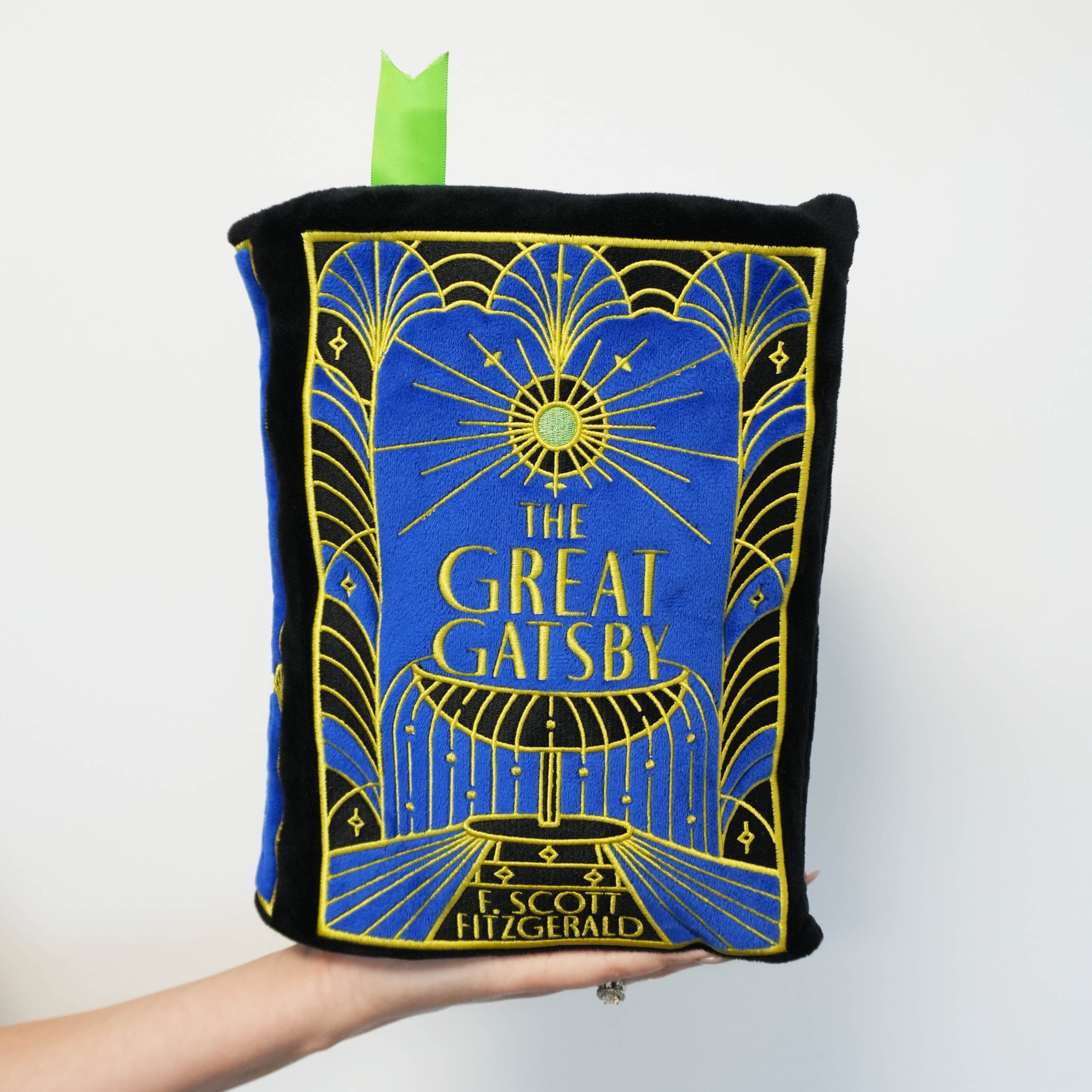 Book-shaped plush with 'The Great Gatsby' design on a white background