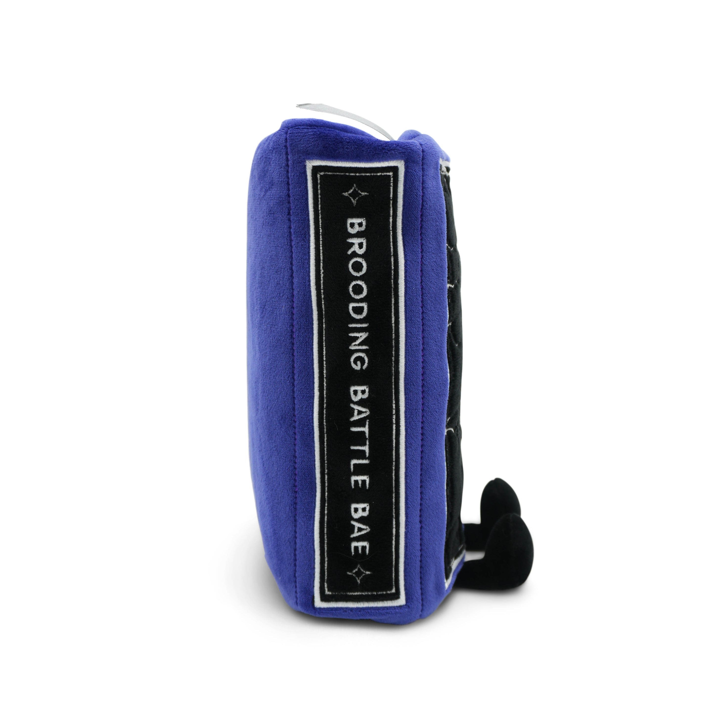 Book plush with 'brooding battle bae' written on the spine