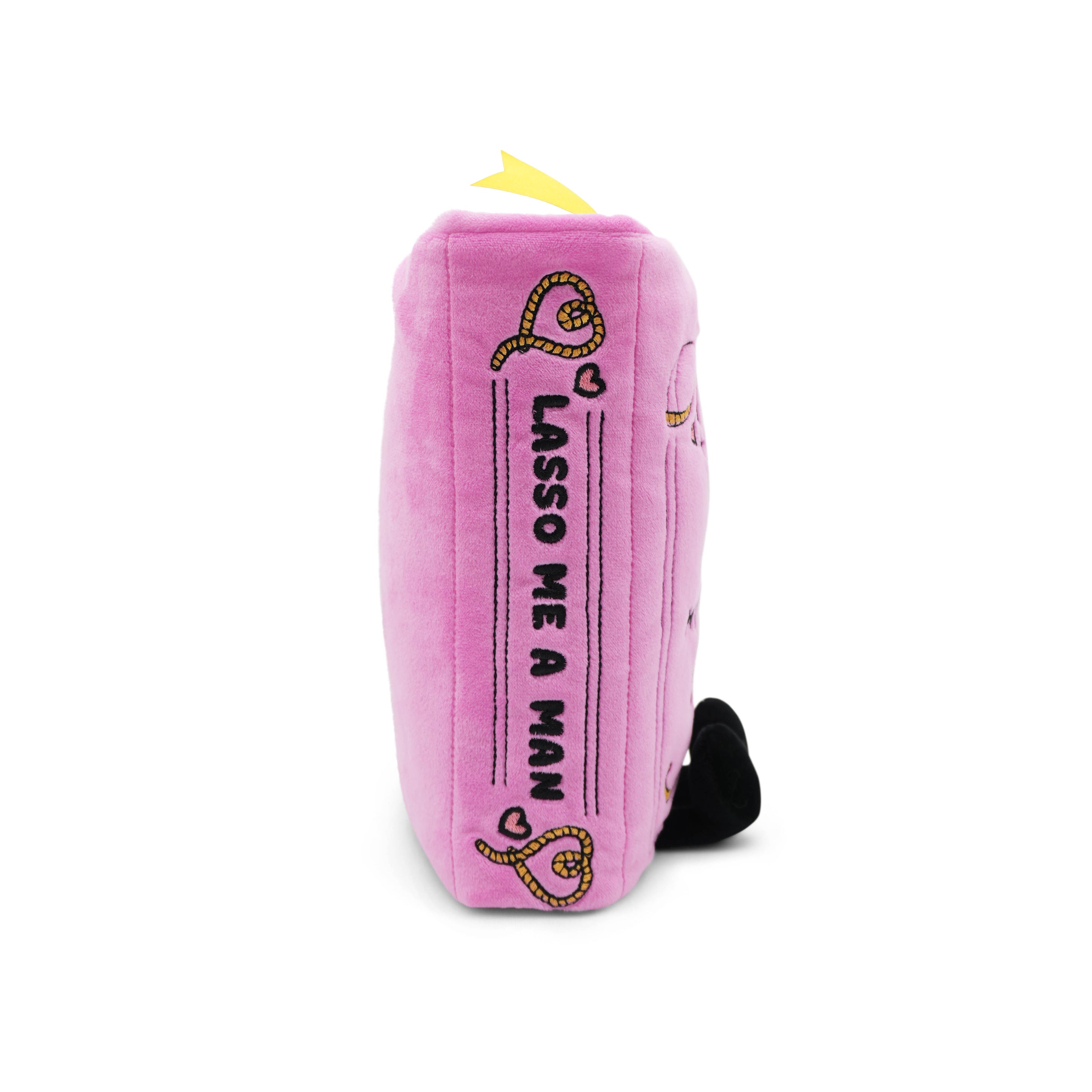 Pink plush book with 'lasso me a man' text written on the spine