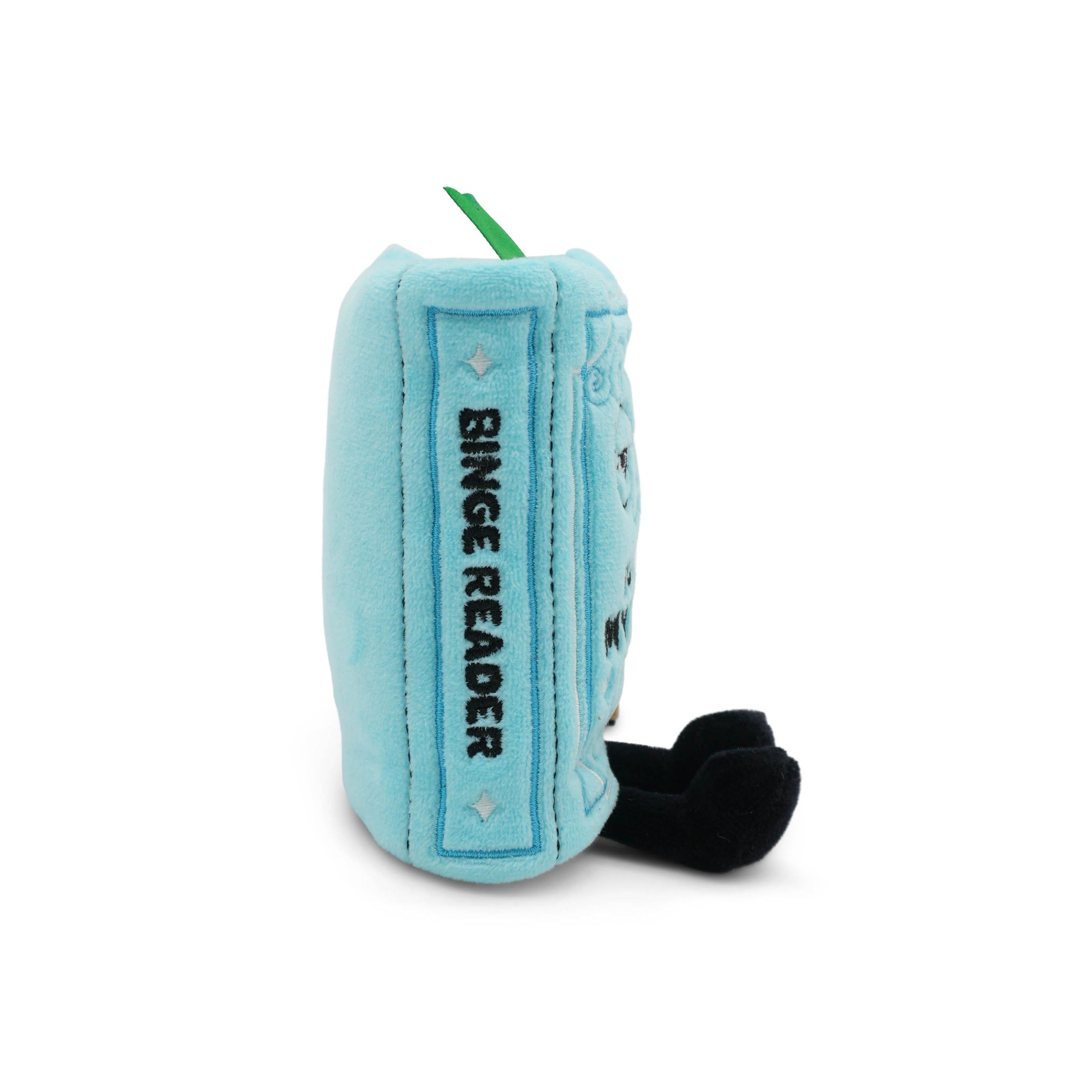 Blue plush book-shaped bag charm with 'Binge Reader' text on the spine taken on a white background