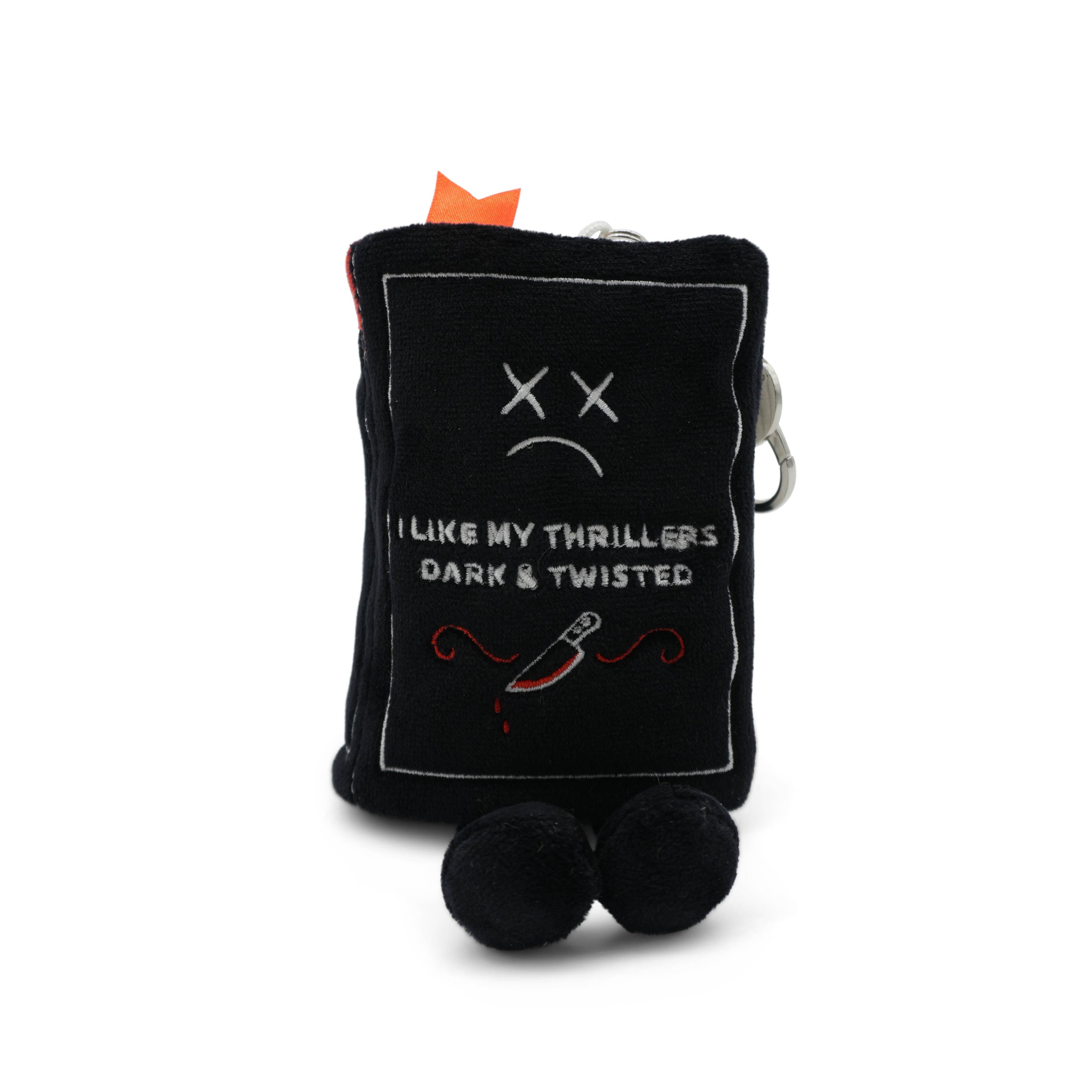Black plush book keychain with the phrase 'I like my thrillers dark & twisted' written on it on a white background