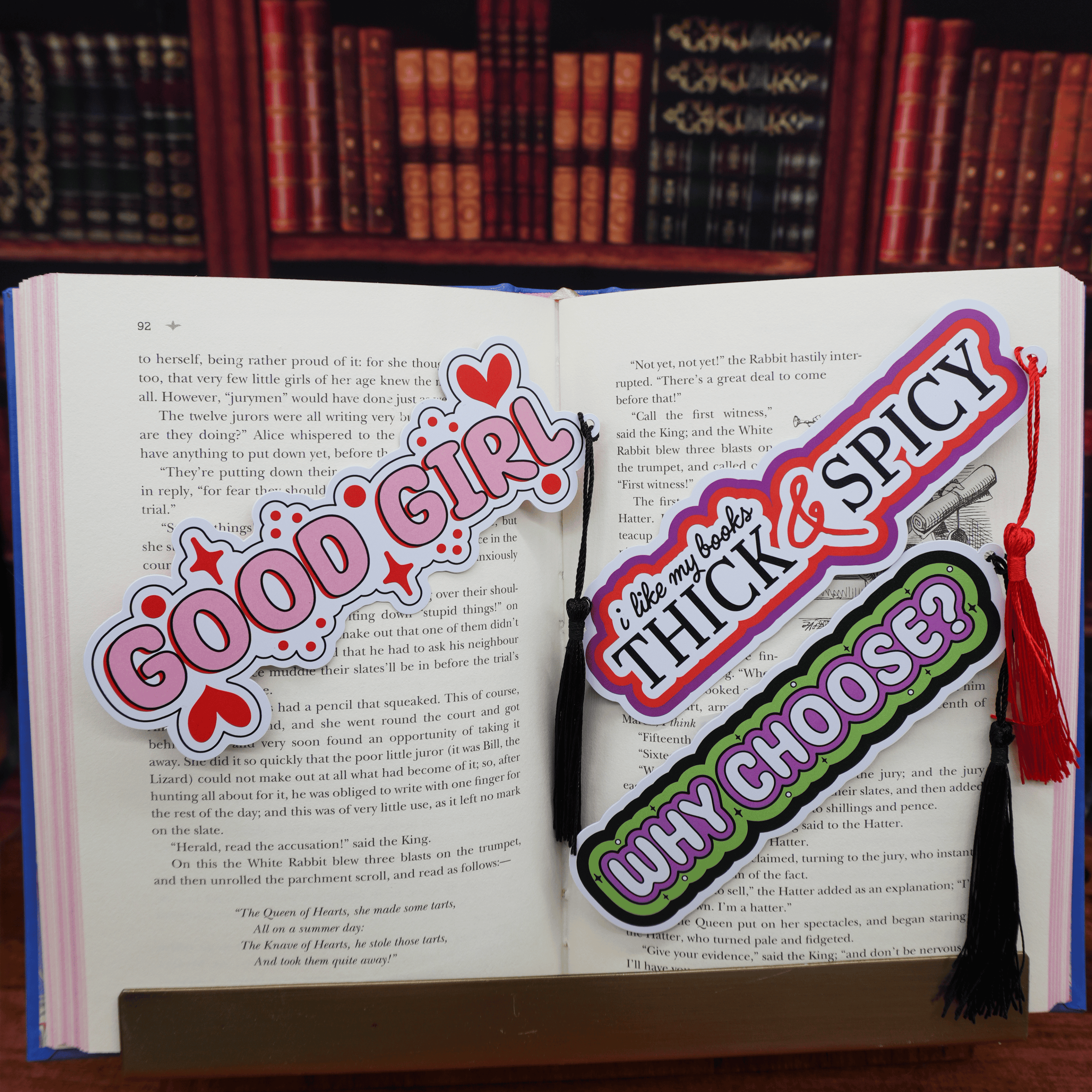 Open book with colorful bookmarks featuring text and graphics.