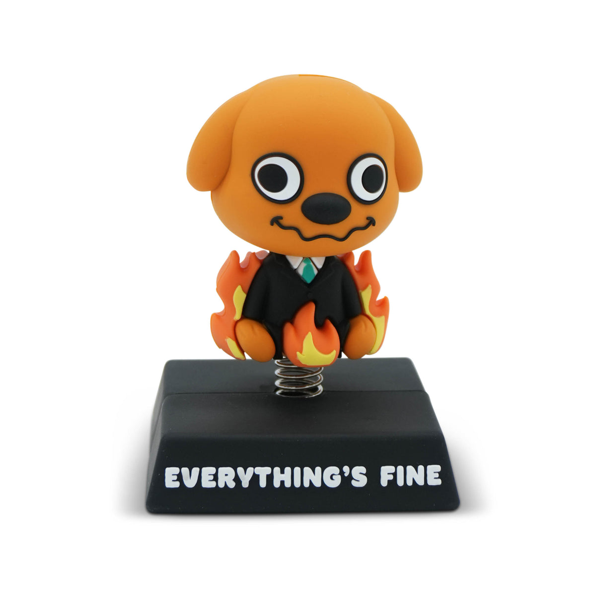 A dog figurine on a black base that reads 'EVERYTHING'S FINE'. The dog is brown with a black suit, white shirt, and green tie, with flames all around it.