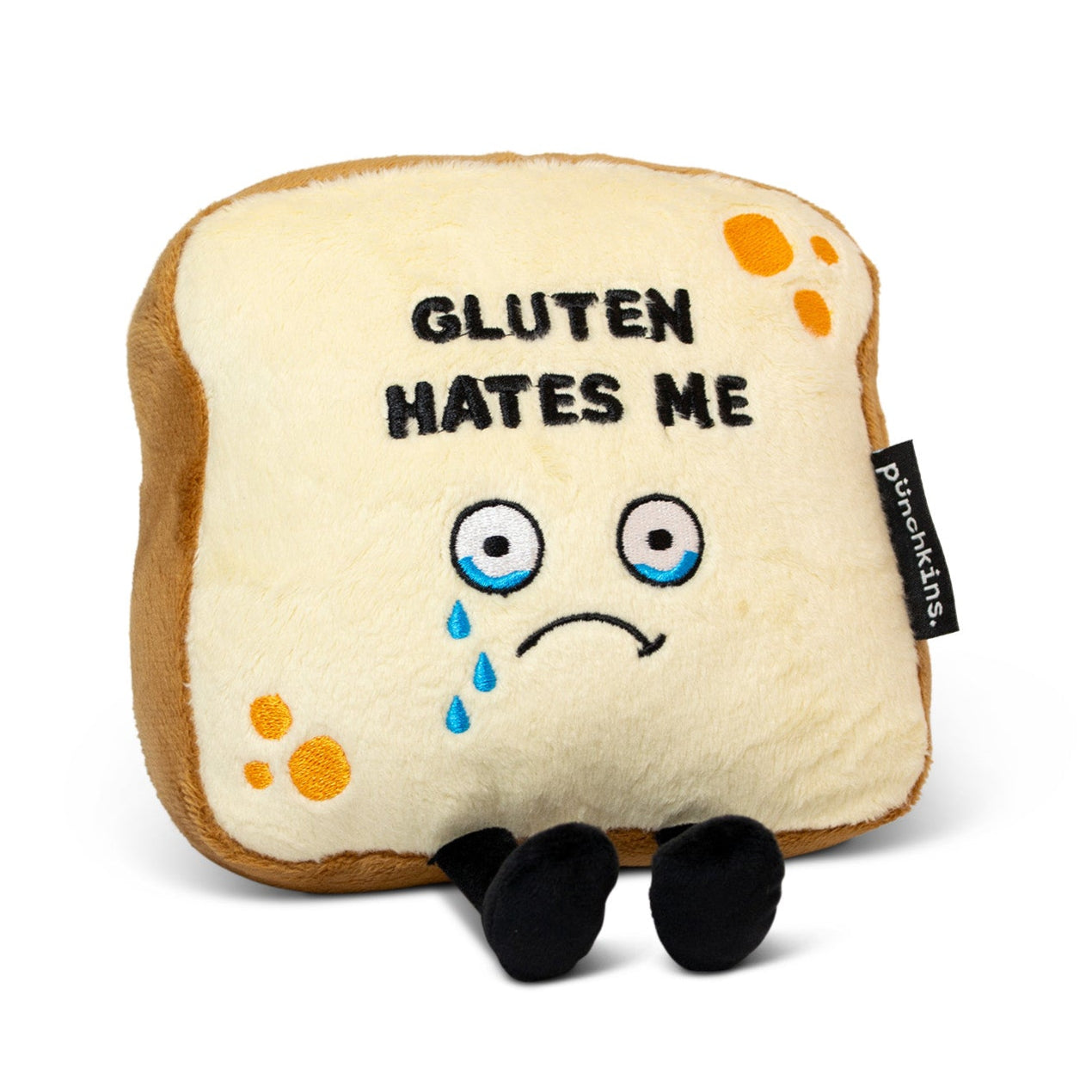A plush resembling a slice of bread with the phrase 'GLUTEN HATES ME' printed on it, with sad facial features and tears depicted on the bread.