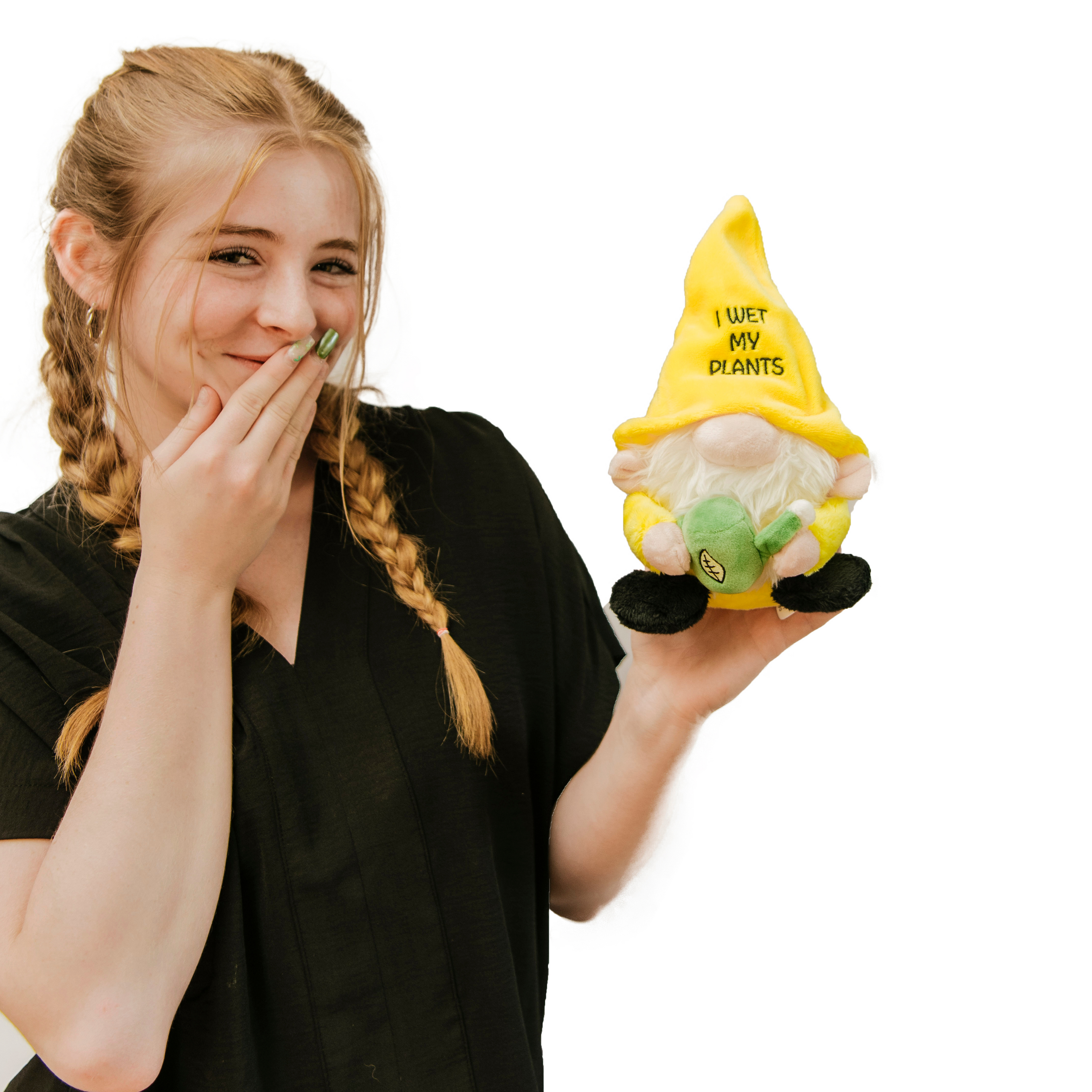 A model holding a plush gnome with a yellow hat and green watering can, with the phrase 'I wet my plants' written on the hat.