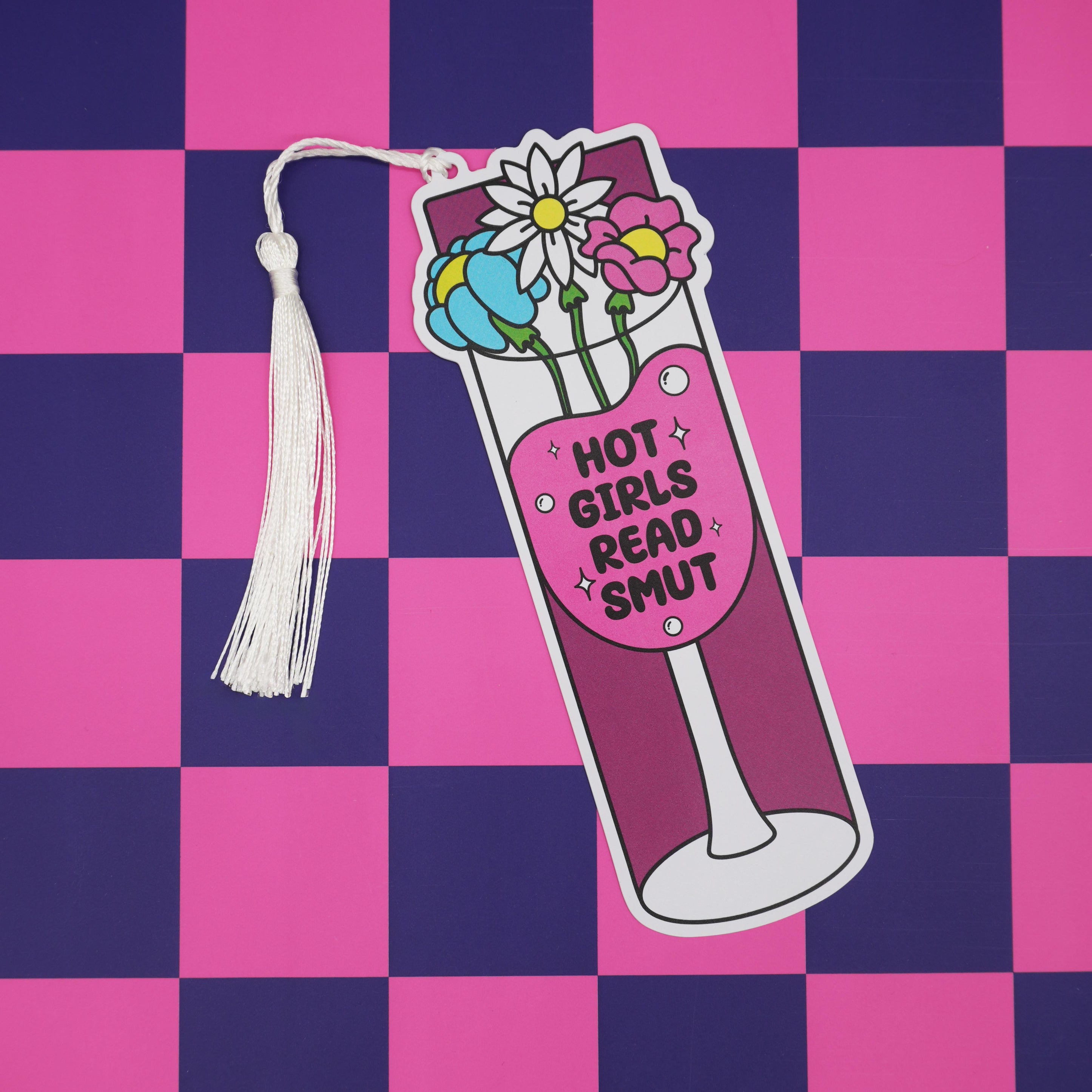 Bookmark with floral design, a wine glass, and 'Hot girls read smut' text on a checkered pink and purple background