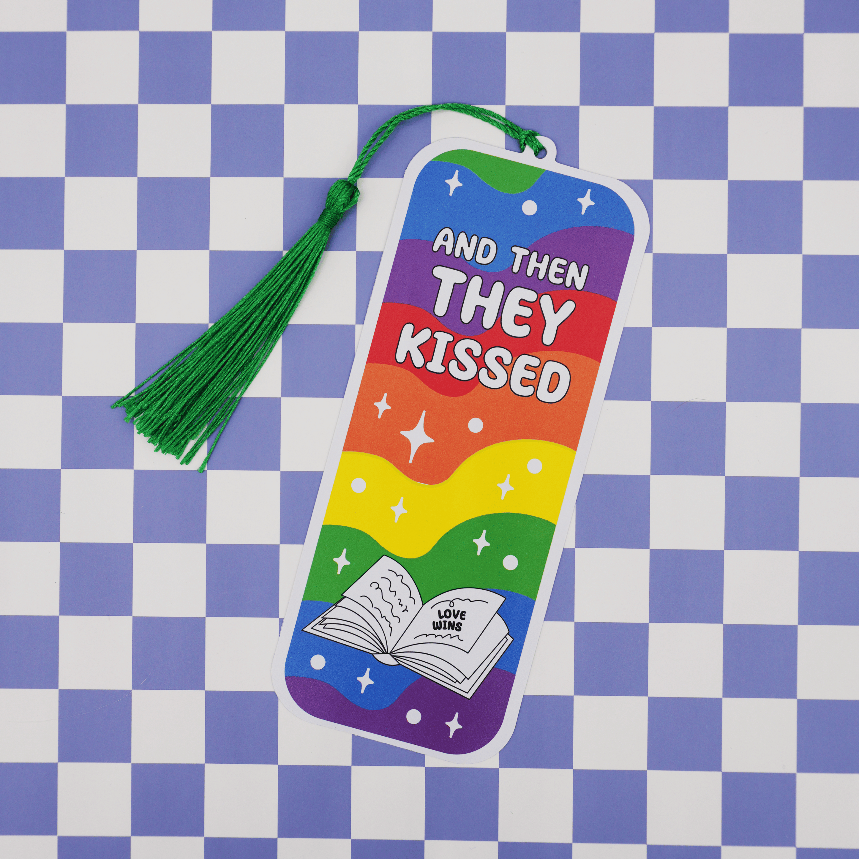 Rainbow-colored bookmark with text on a checkered background