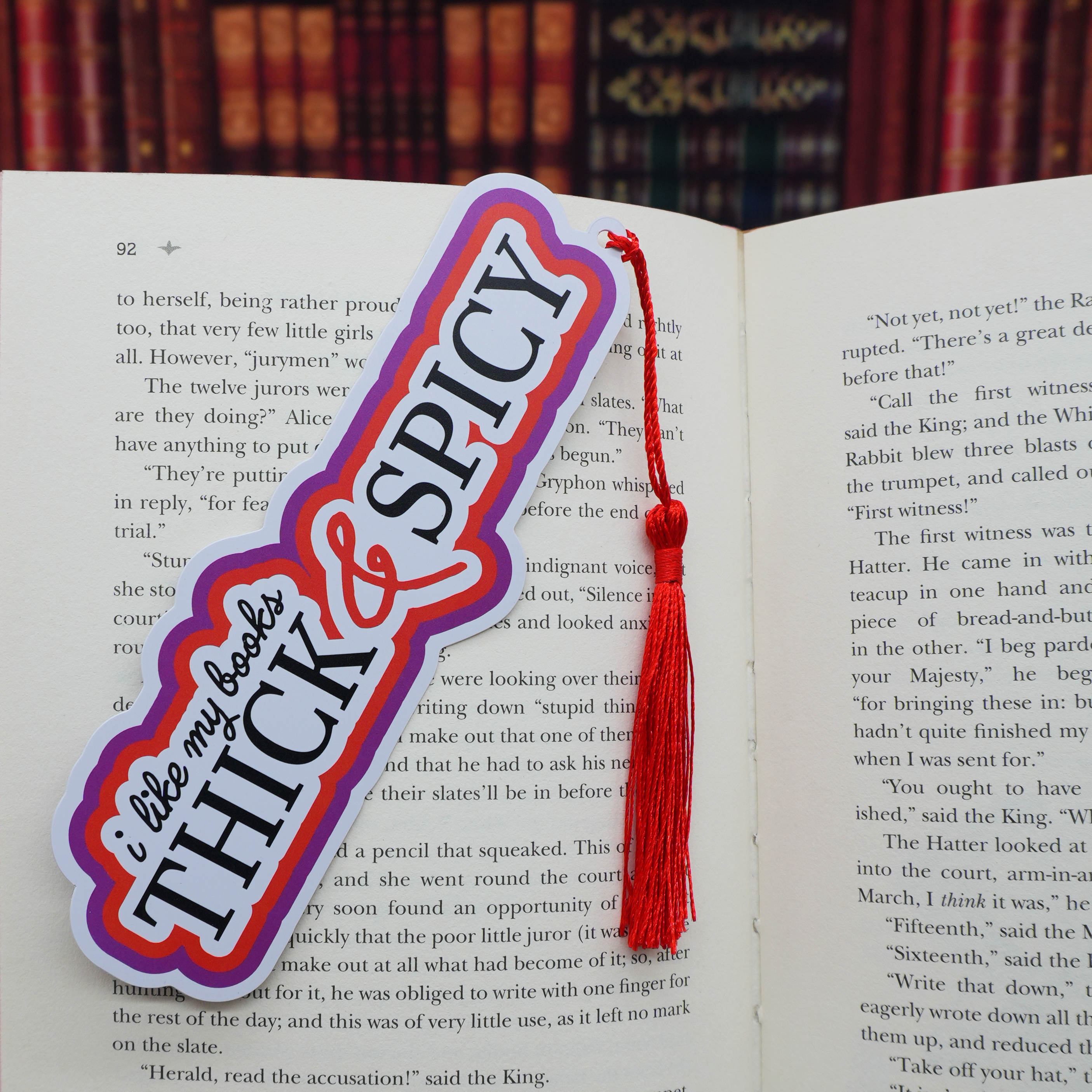 Bookmark with 'thick & spicy' text on an open book
