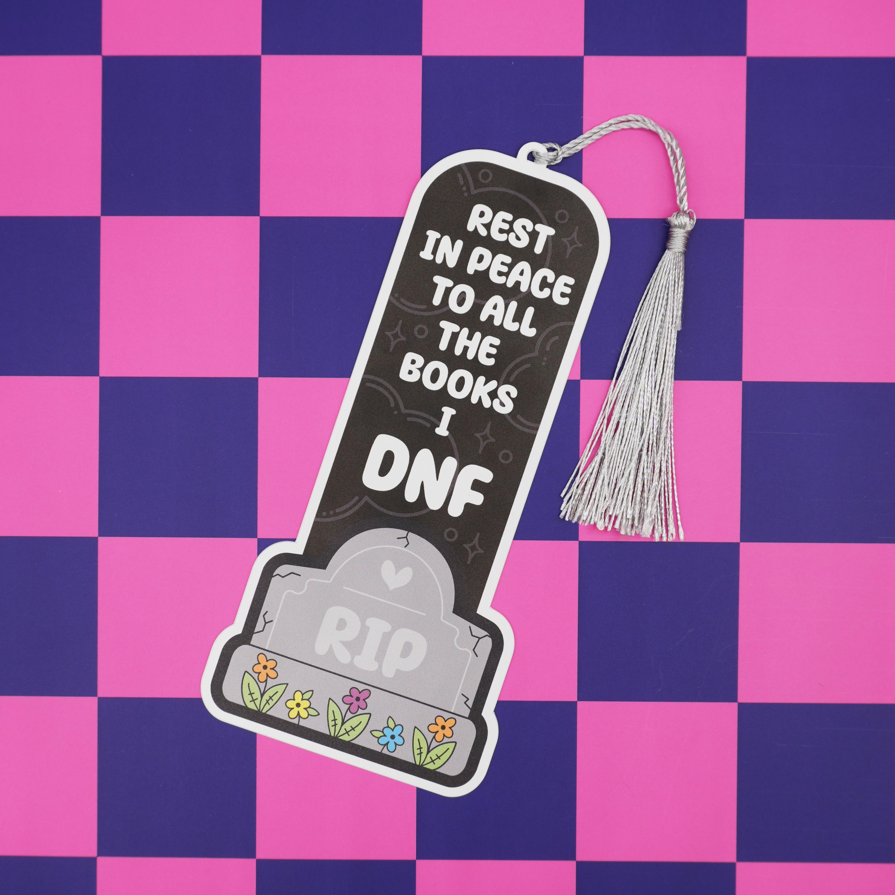 Bookmark with 'Rest in Peace to all the books I DNF' text on a checkered background