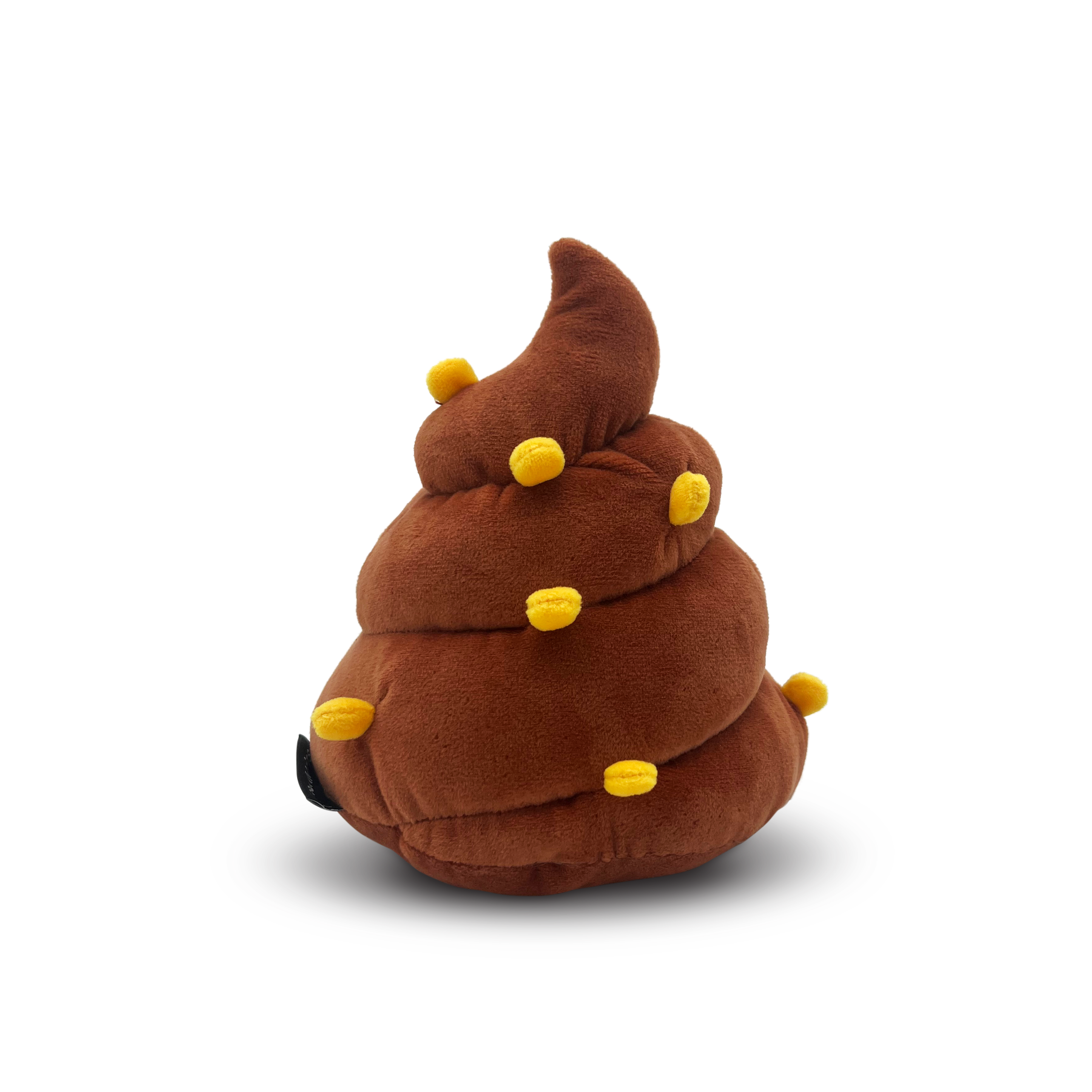 Back of plush poop with pieces of corn sticking out.