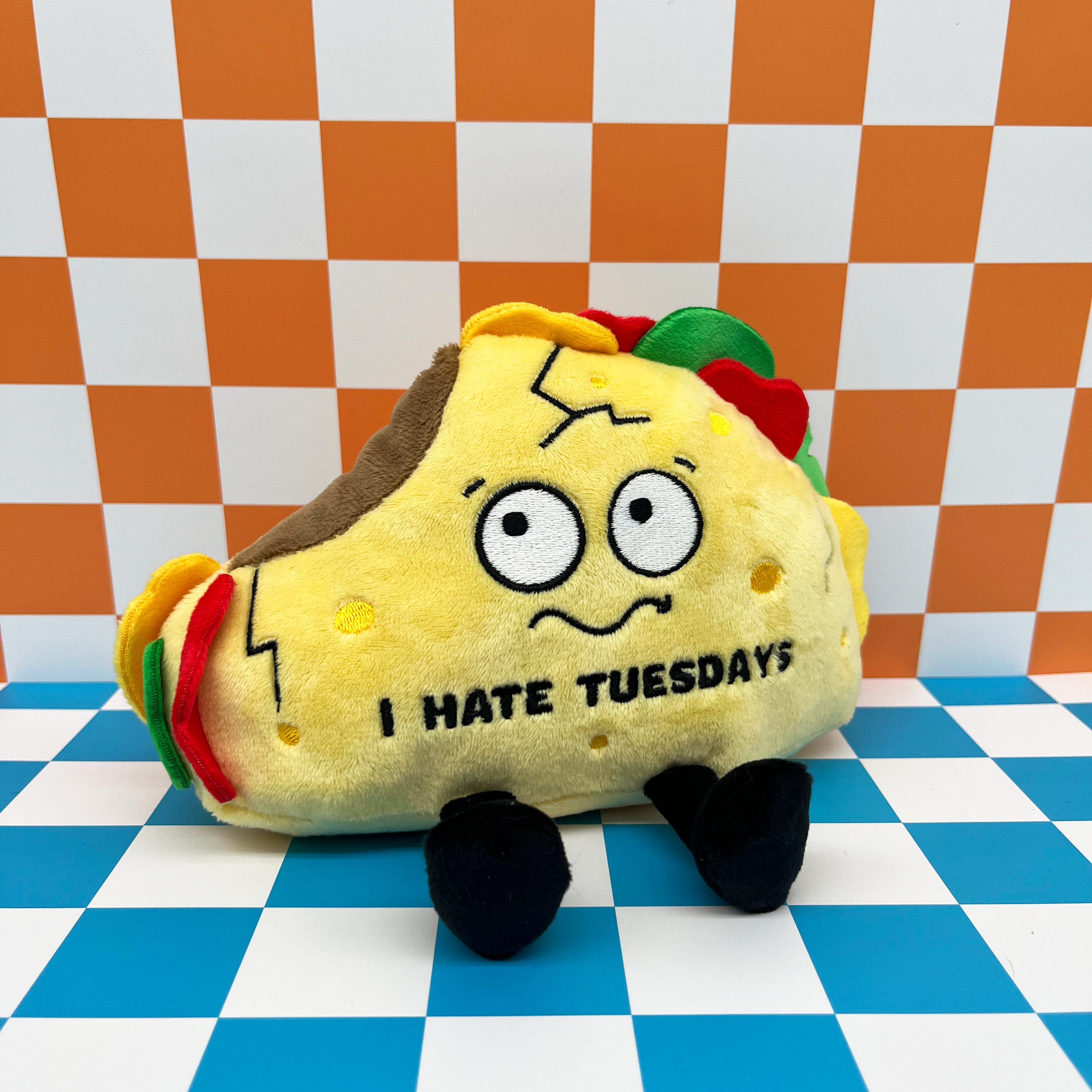 Plush taco on a checkered background