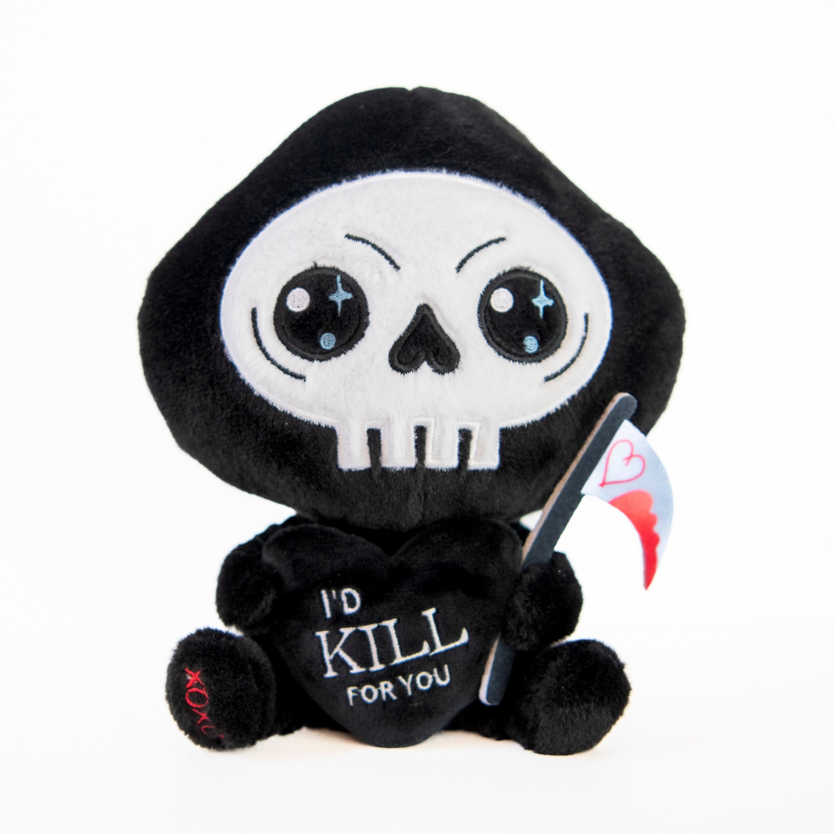 A plush toy resembling a grim reaper with a bloody scythe, embroidered details, and the text 'I'd kill for you' on a heart-shaped tag.
