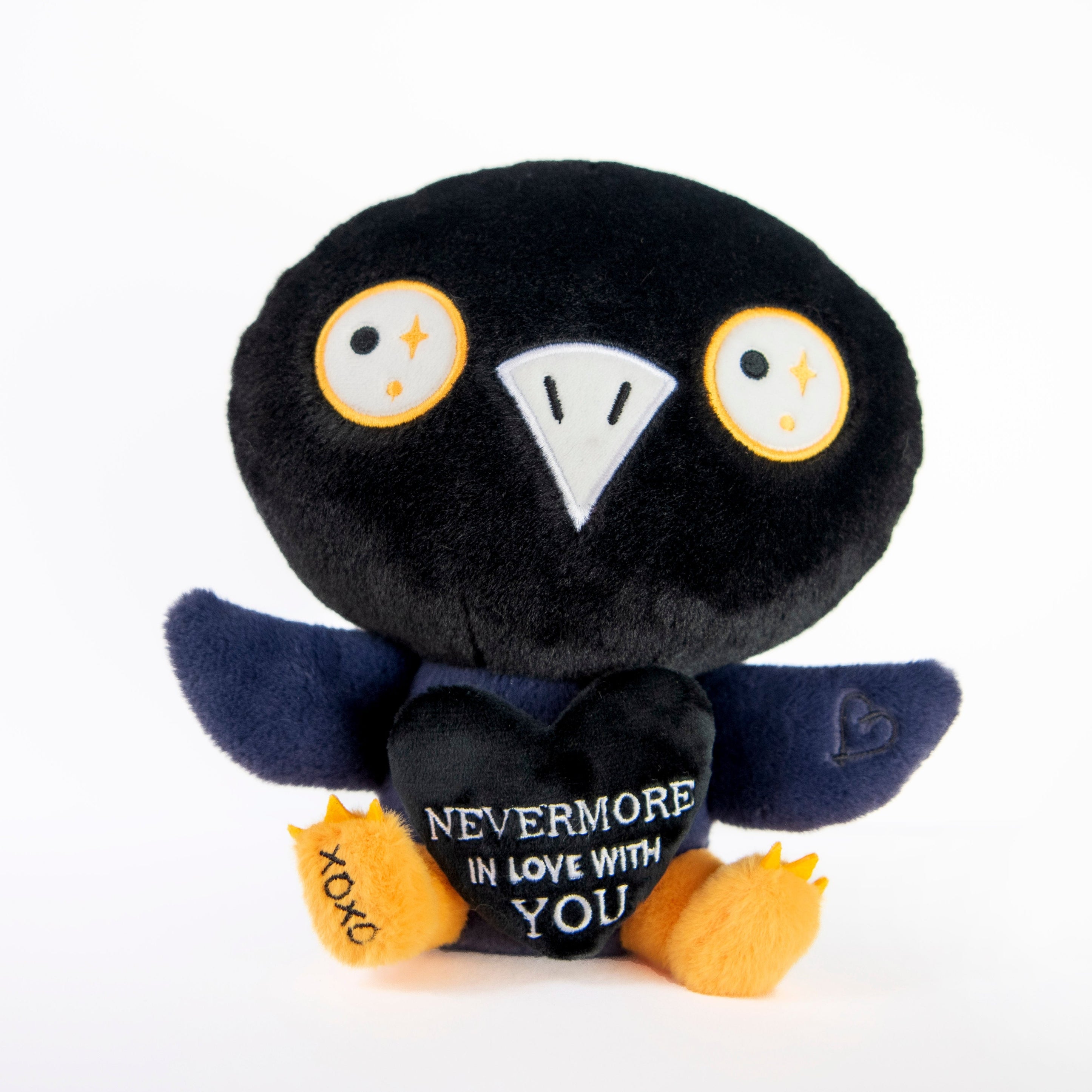 A plush raven toy with black body, yellow feet, and text on its chest that says 'NEVERMORE IN LOVE WITH YOU'.
