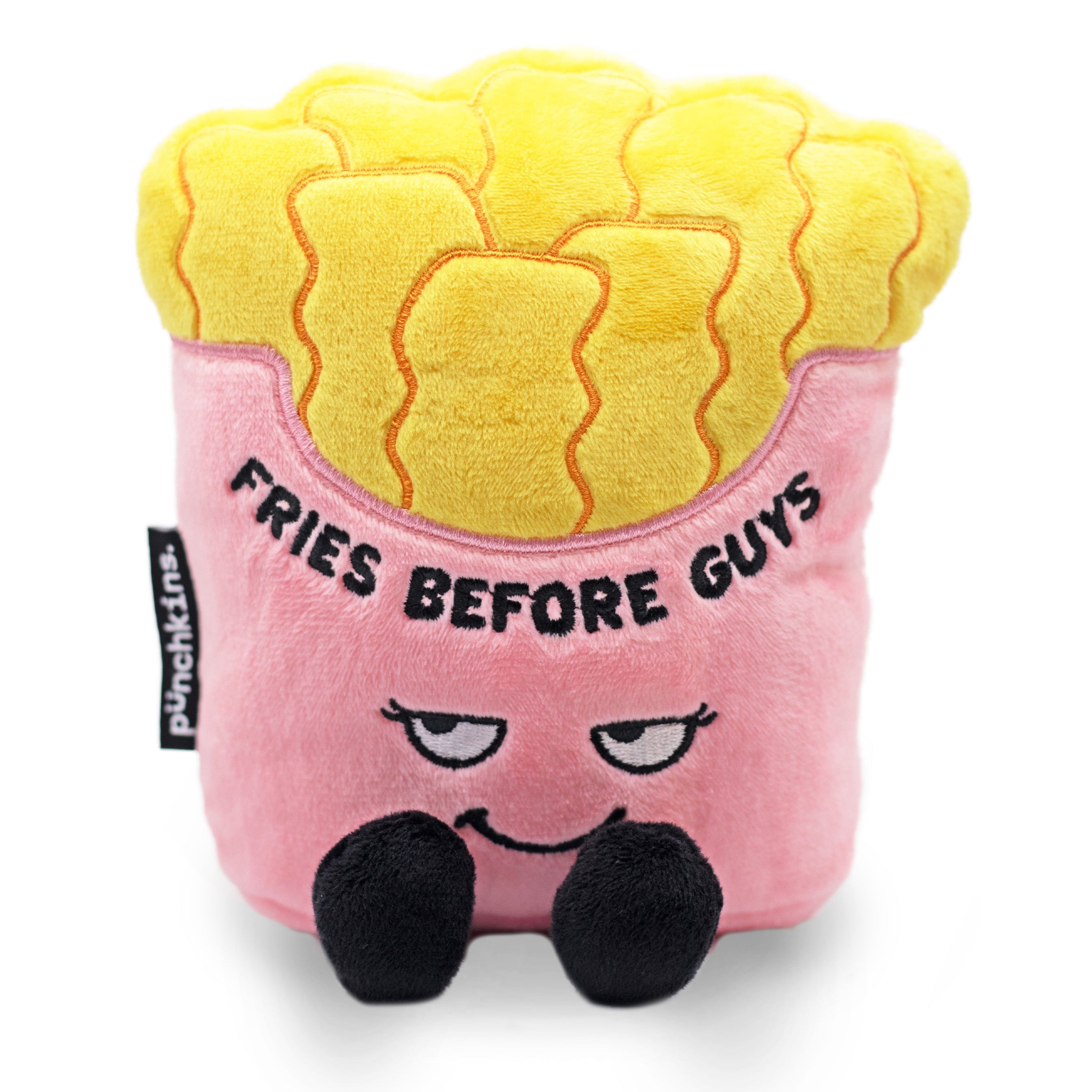 A plush resembling a cartoon version of French fries with eyes and a mouth, holding a sign that says 'Fries Before Guys'.