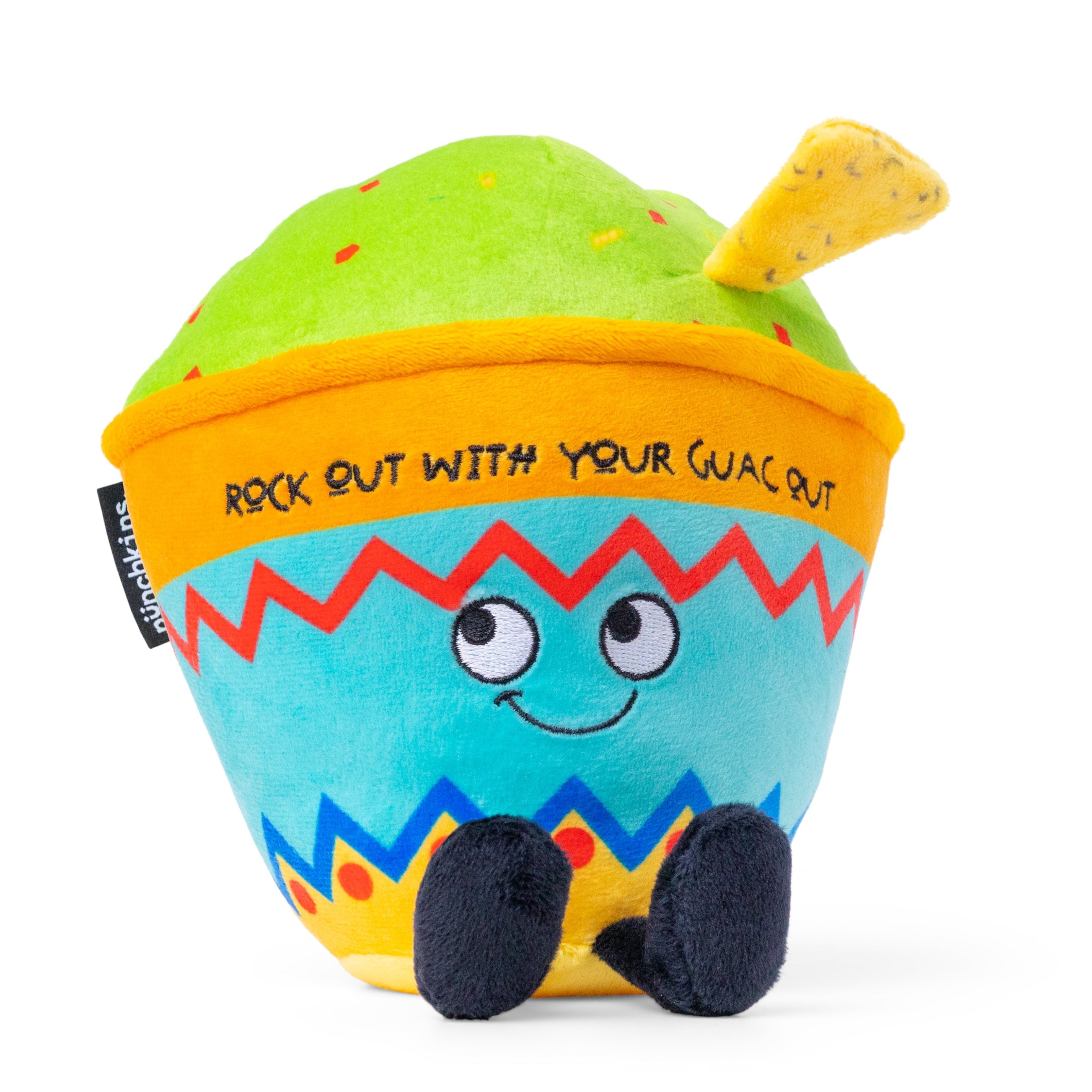 A colorful plush shaped like a guacamole bowl with the text 'ROCK OUT WITH YOUR GUAC OUT'.