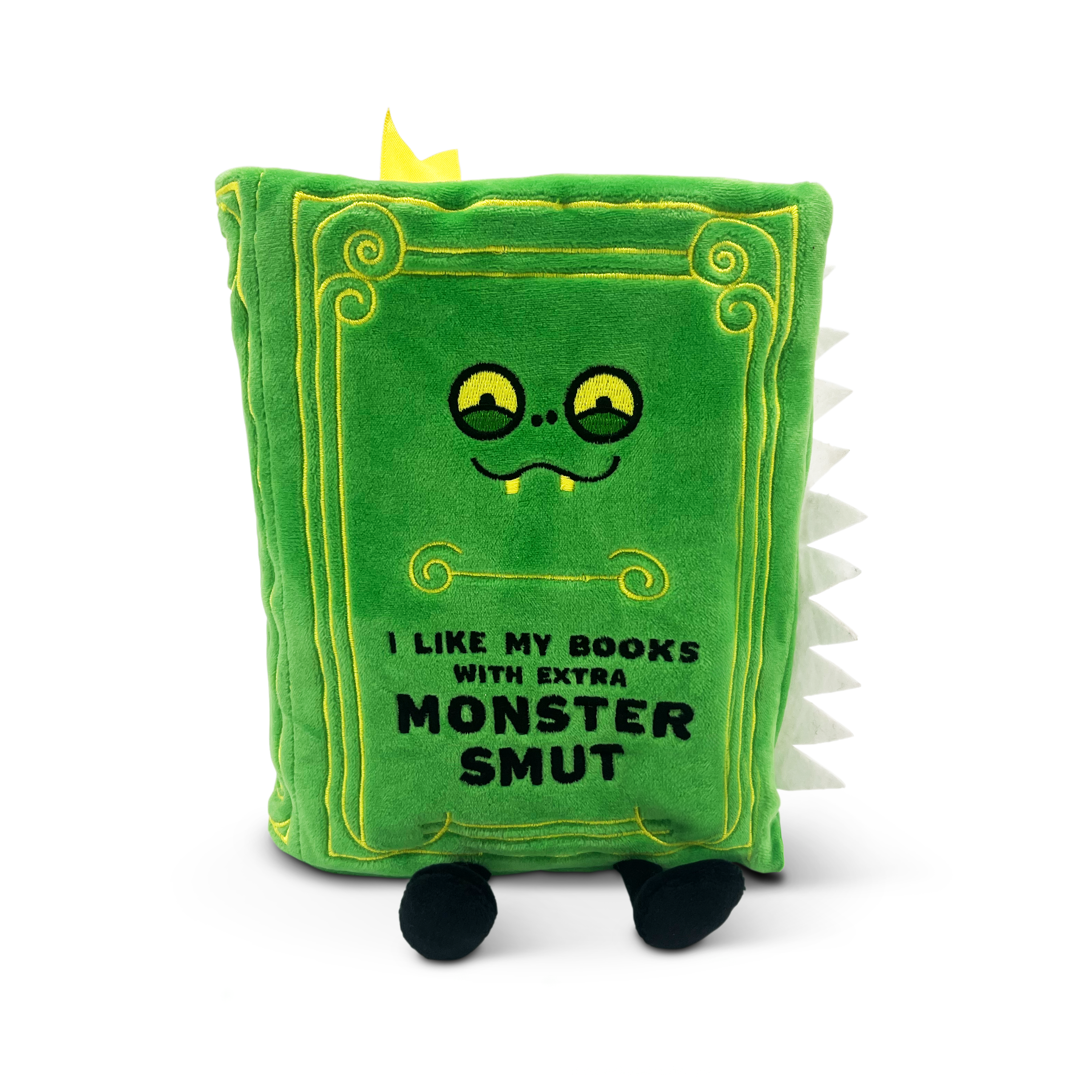 A plush book with a monster face and the text 'I like my books with extra monster smut' embroidered on the front.
