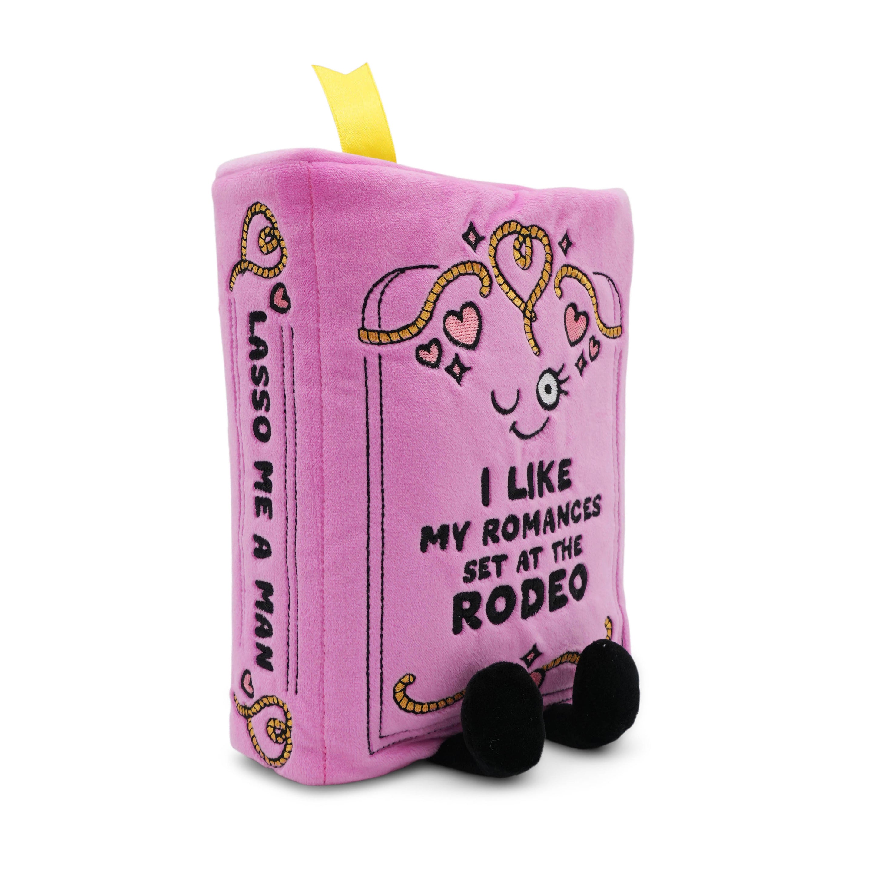 Pink plush book with text and heart designs on a white background