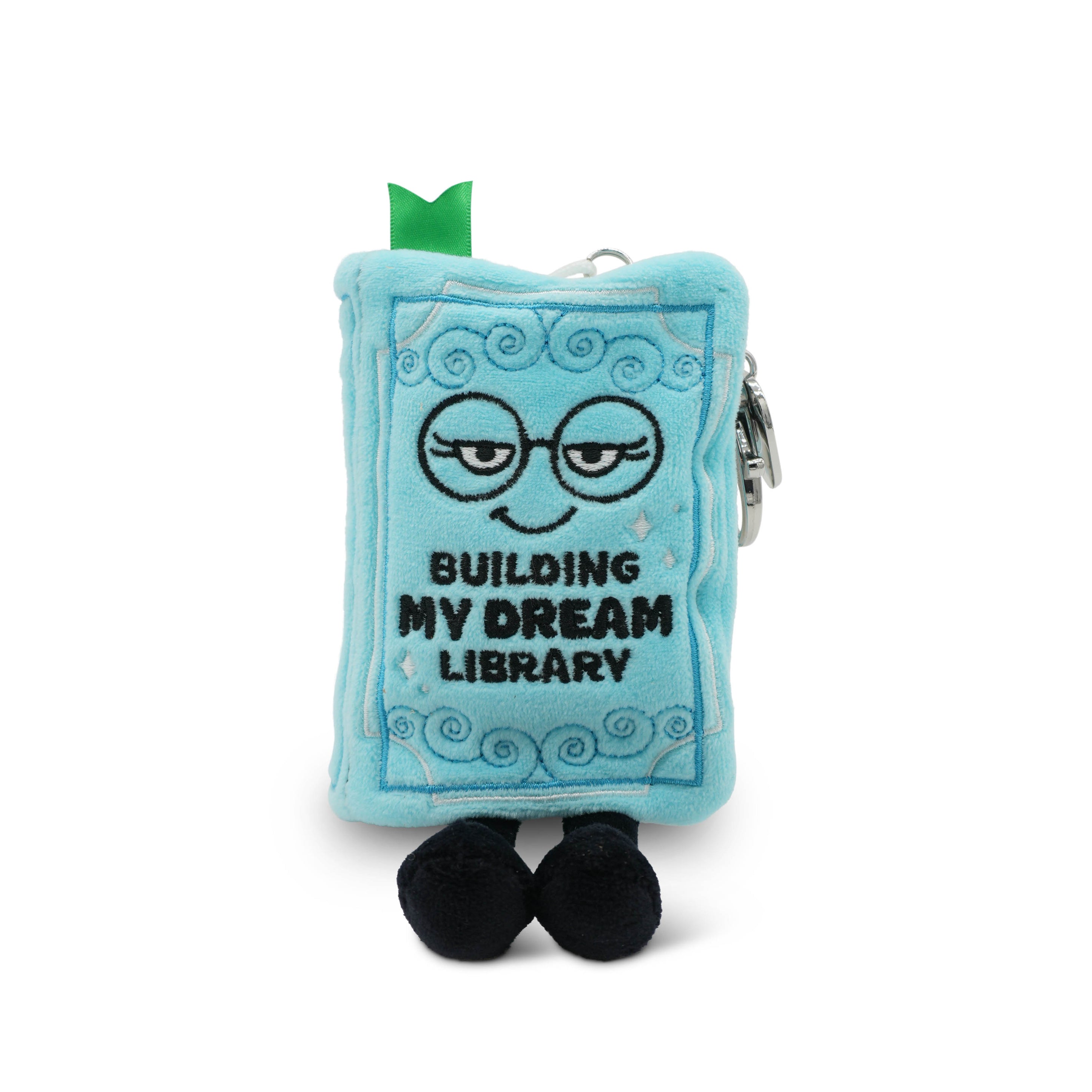 Plush book bag charm with with 'Building My Dream Library' written on it taken on a white background