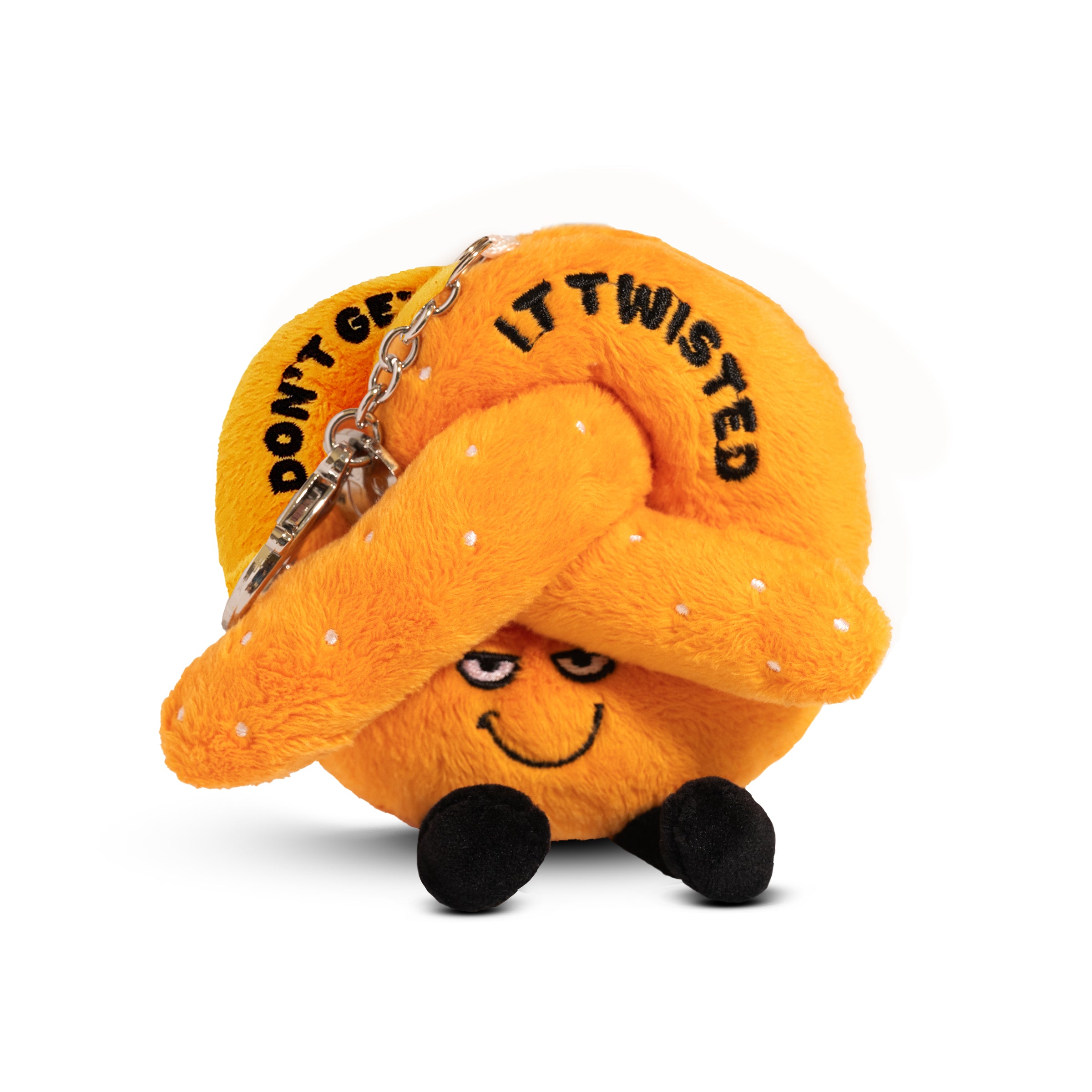 A plush bag charm shaped like a pretzel with a smiley face and the text 'DON'T GET IT TWISTED' printed on it. 