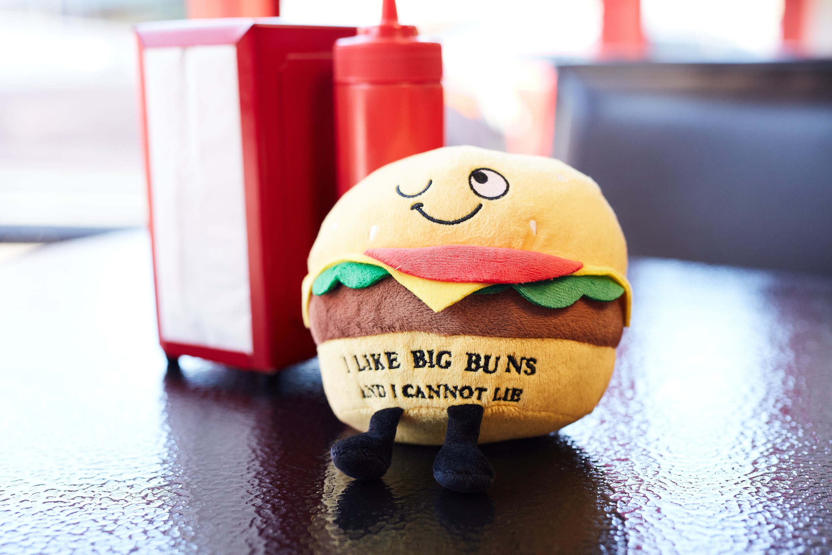 Plush cheesebuger at a restaurant