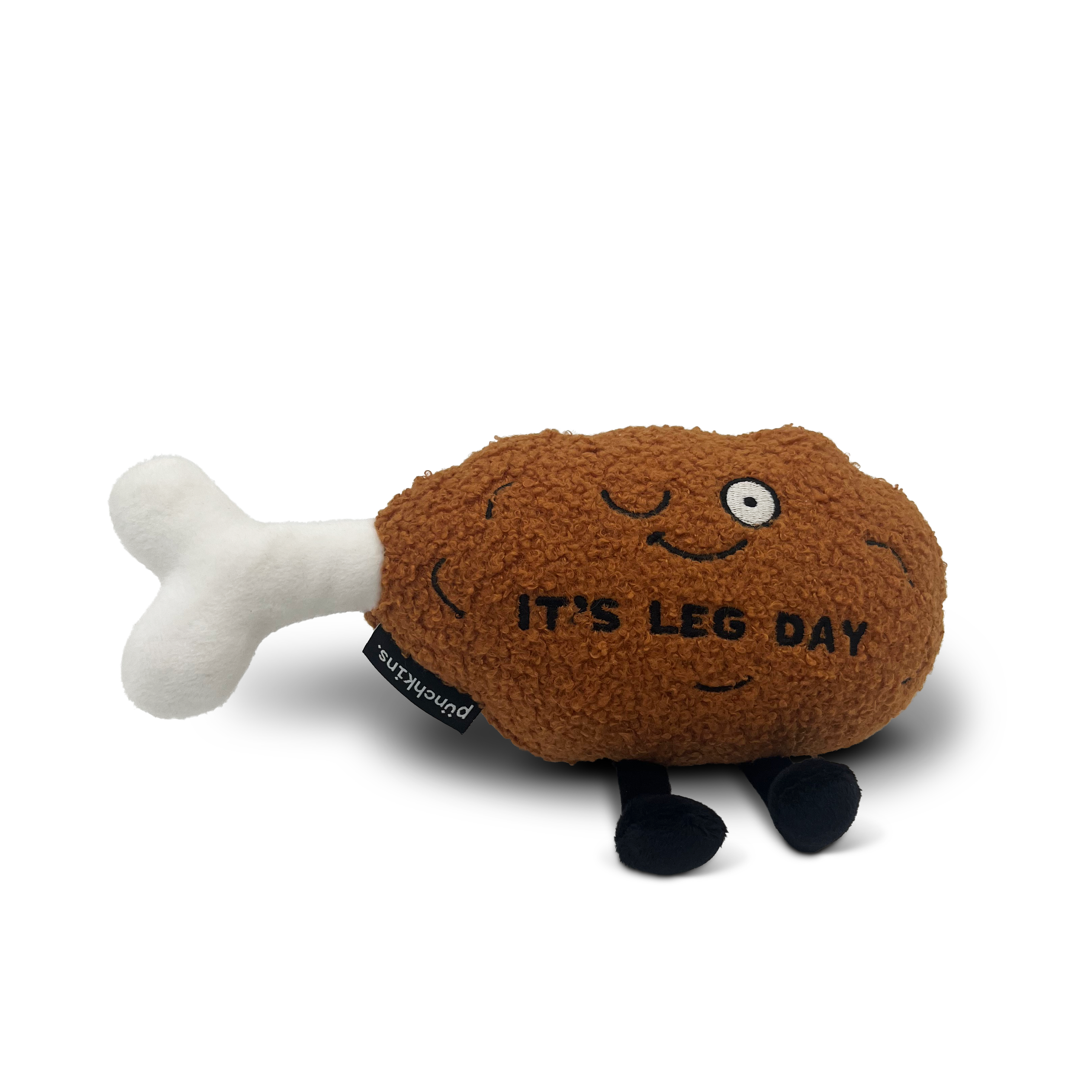 A plush chicken leg with a smiling face and the text 'IT'S LEG DAY' on it.