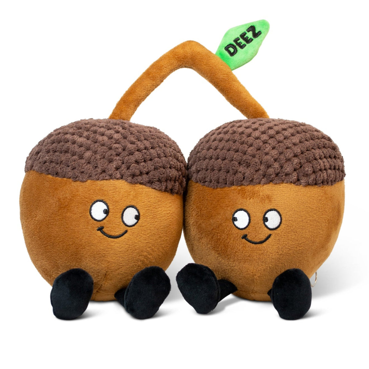 Two plush acorn toys with faces, a stem, and a leaf that reads 'DEEZ'.