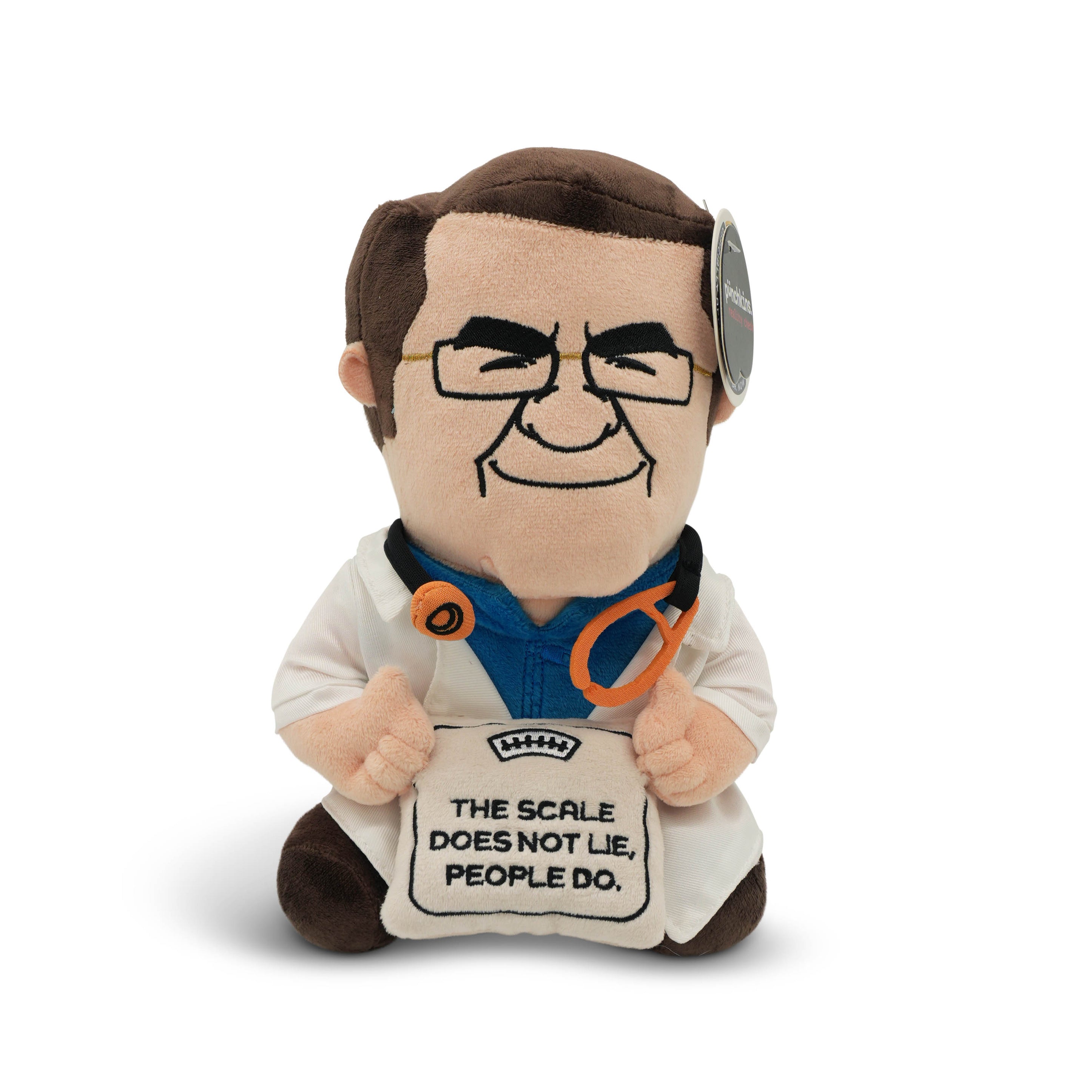 Plush toy resembling Dr. Now, who is wearing glasses and a stethoscope, holding a scale that reads, "The scale does not lie, people do."