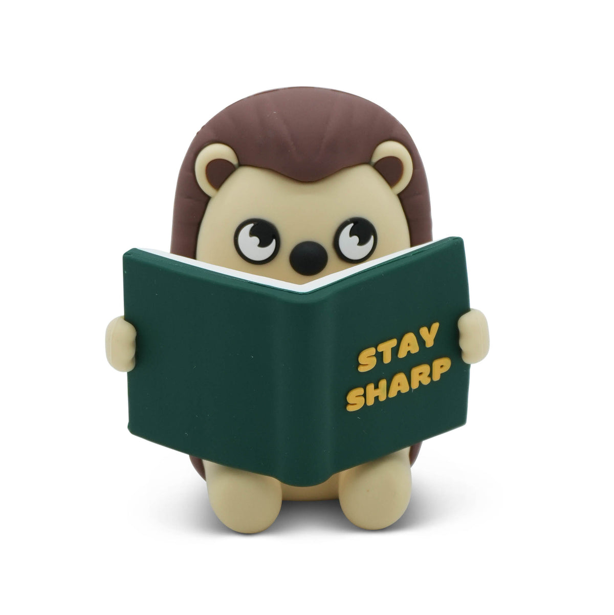 A cute hedgehog figurine holding a green book with the words 'STAY SHARP' in yellow, set against a plain white background.