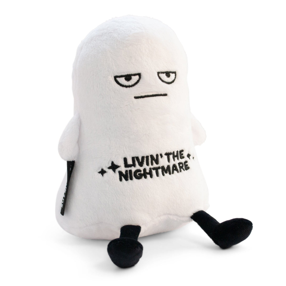 A plush resembling a ghost with a grumpy facial expression and the text 'LIVIN' THE NIGHTMARE' on its chest.
