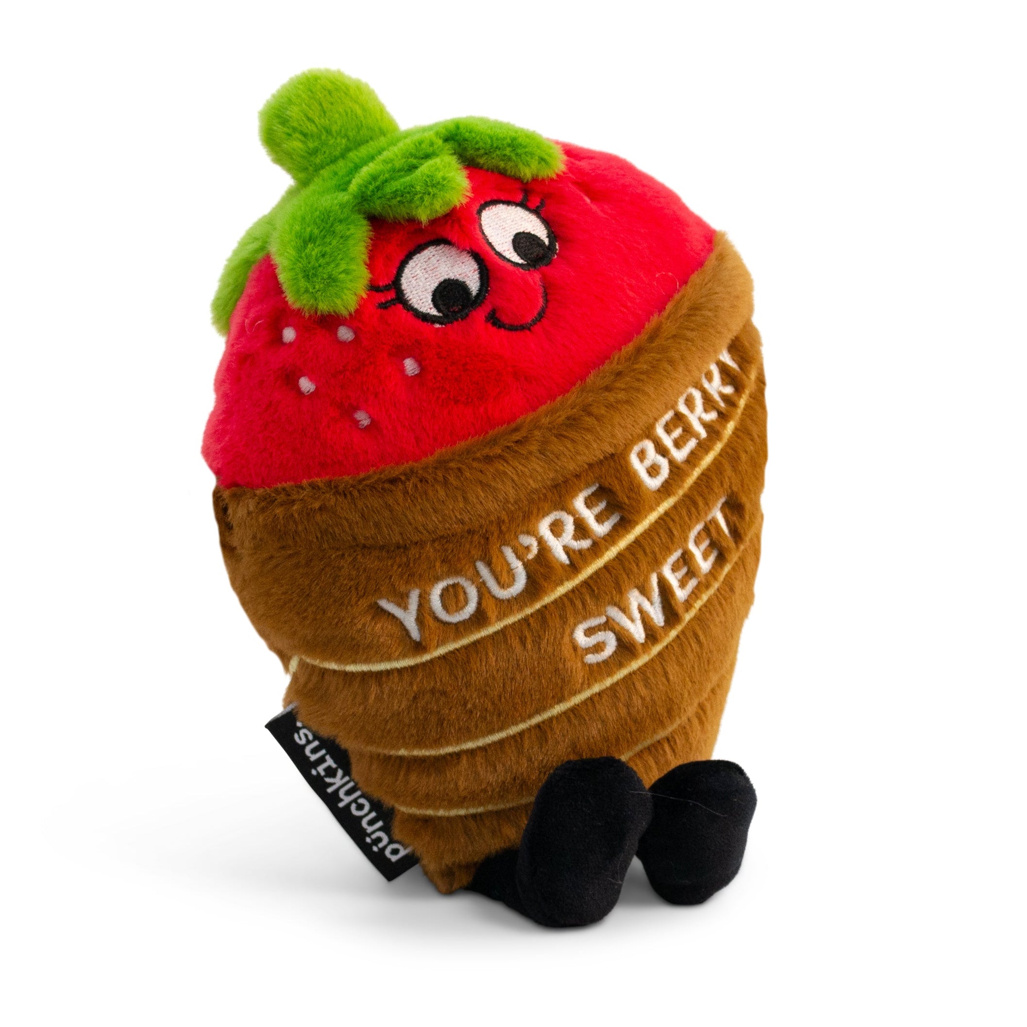 A plush resembling a chocolate covered strawberry. It has eyes and dangly legs, and there is text on the base that reads 'YOU'RE BERRY SWEET'.
