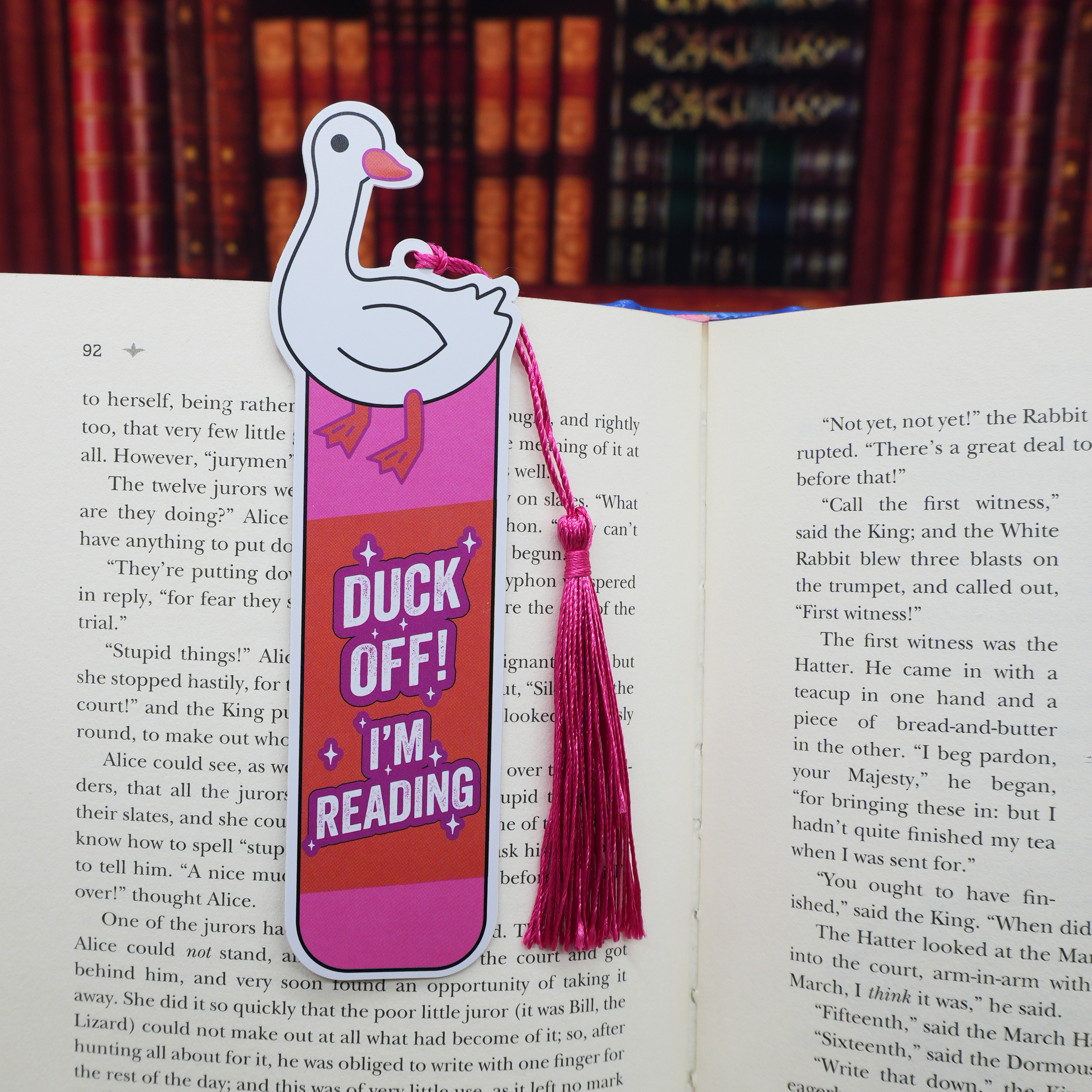 Bookmark with duck design and text 'Duck off! I'm reading' on an open book.