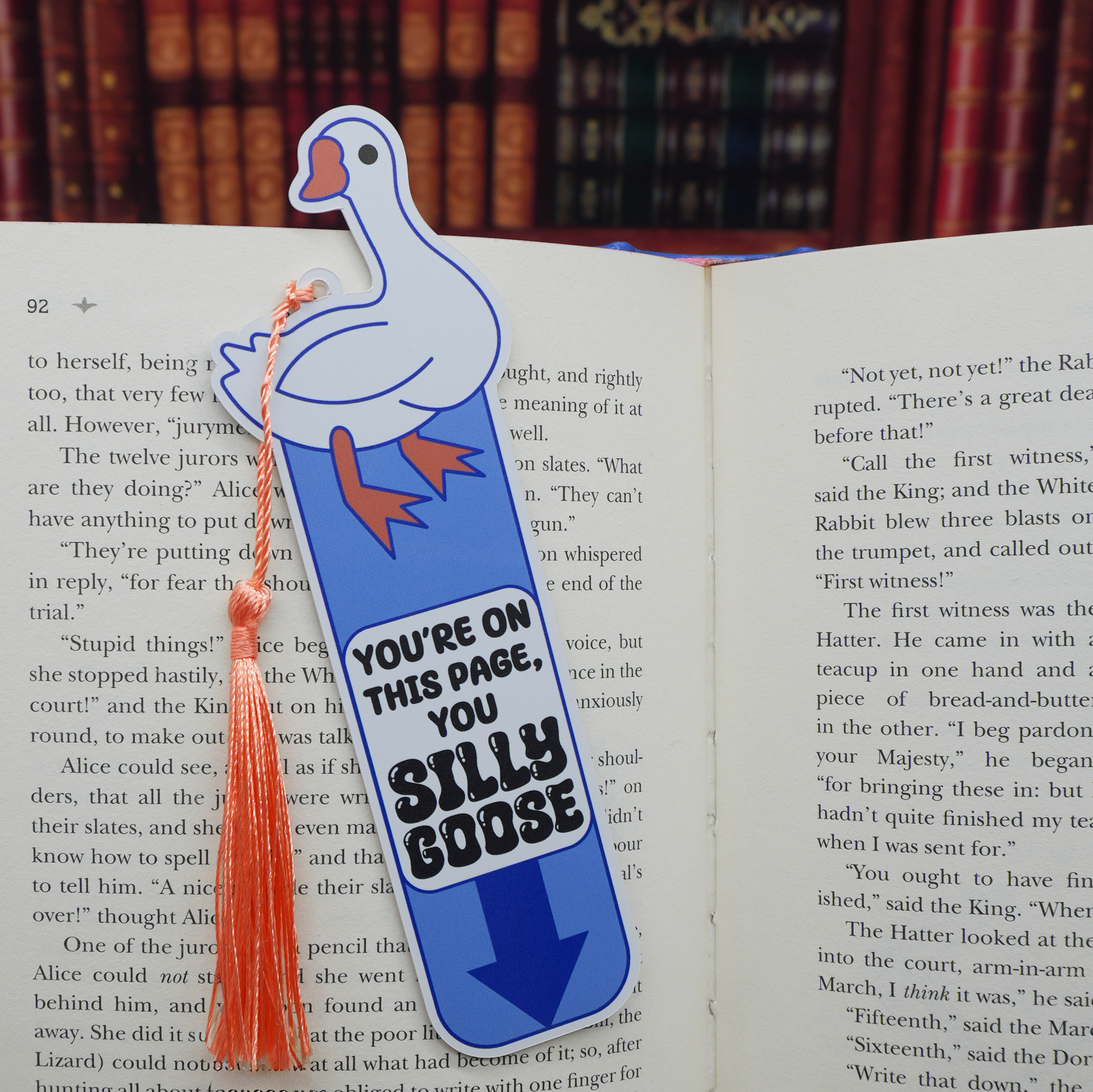 Bookmark with cartoon goose design on an open book