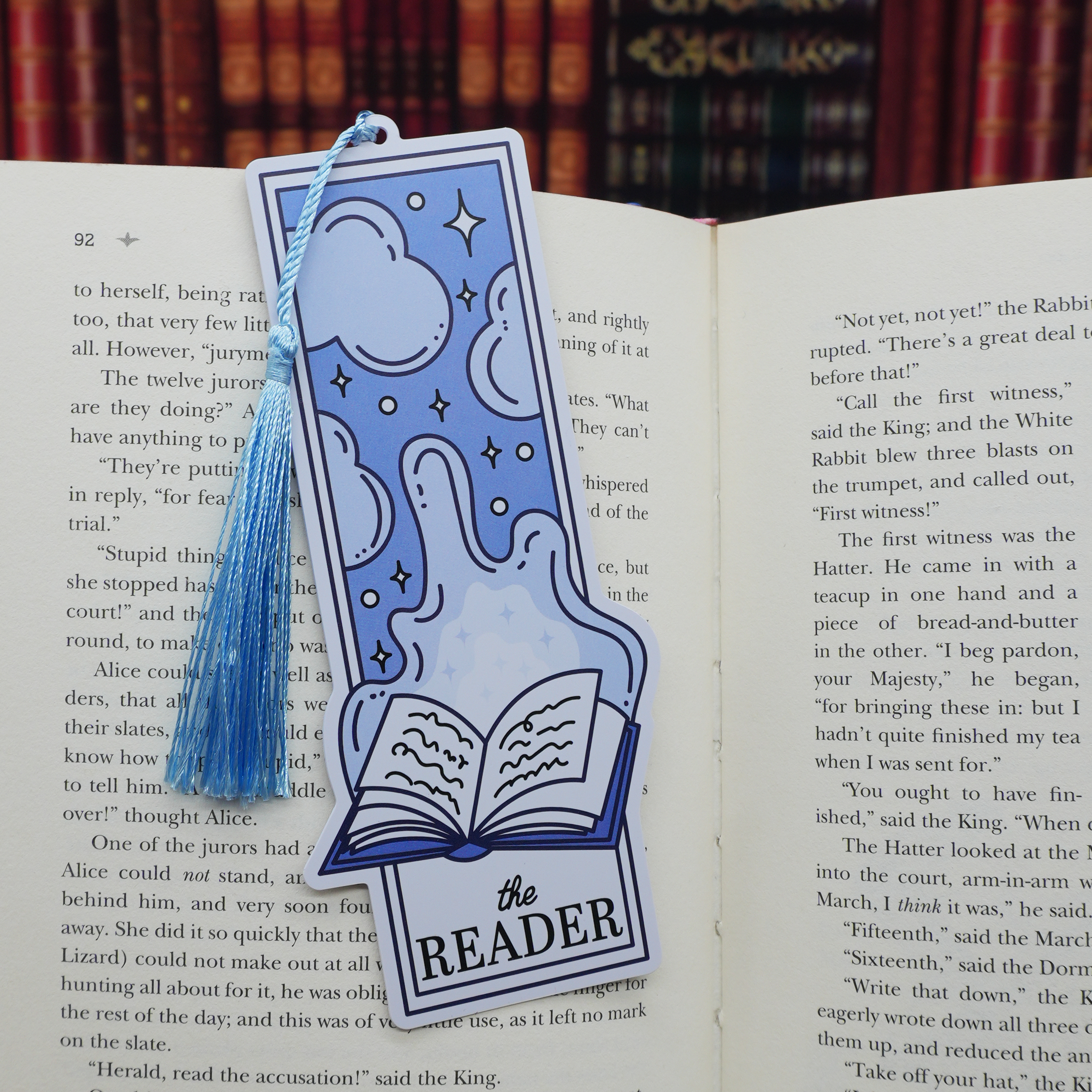 Blue the reader bookmark with tassel on an open book