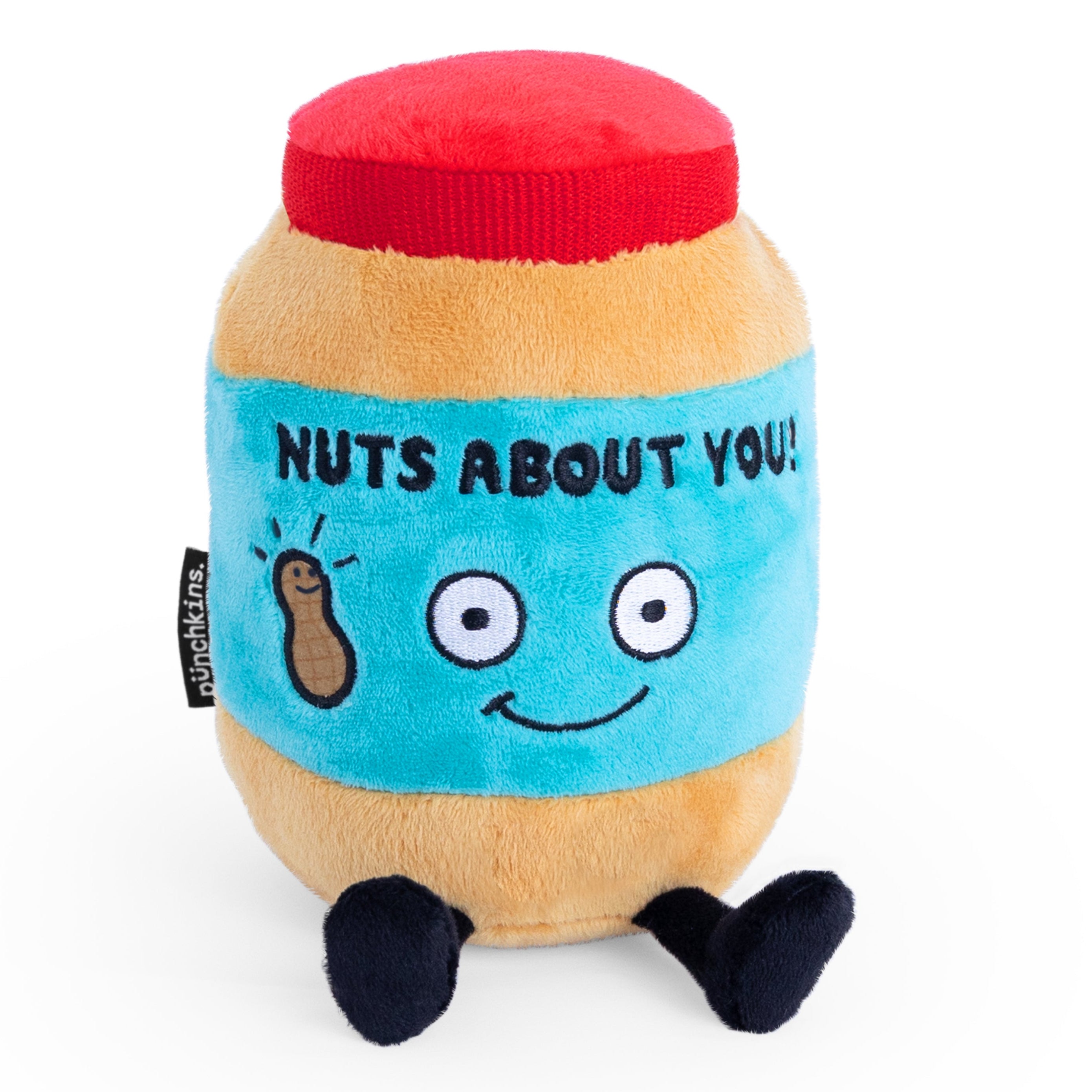 A plush resembling a peanut butter jar with a face and feet,  with the text 'NUTS ABOUT YOU! written on it.