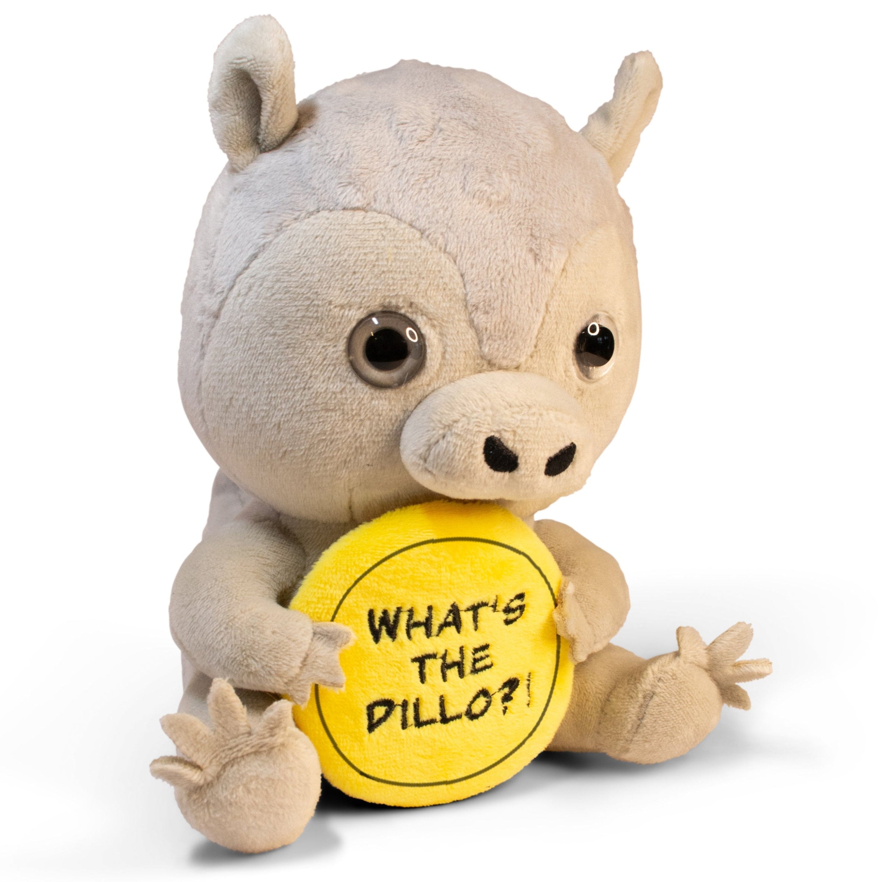 A plush resembling an armadillo holding a yellow sign with the text 'WHAT'S THE DILLO?'