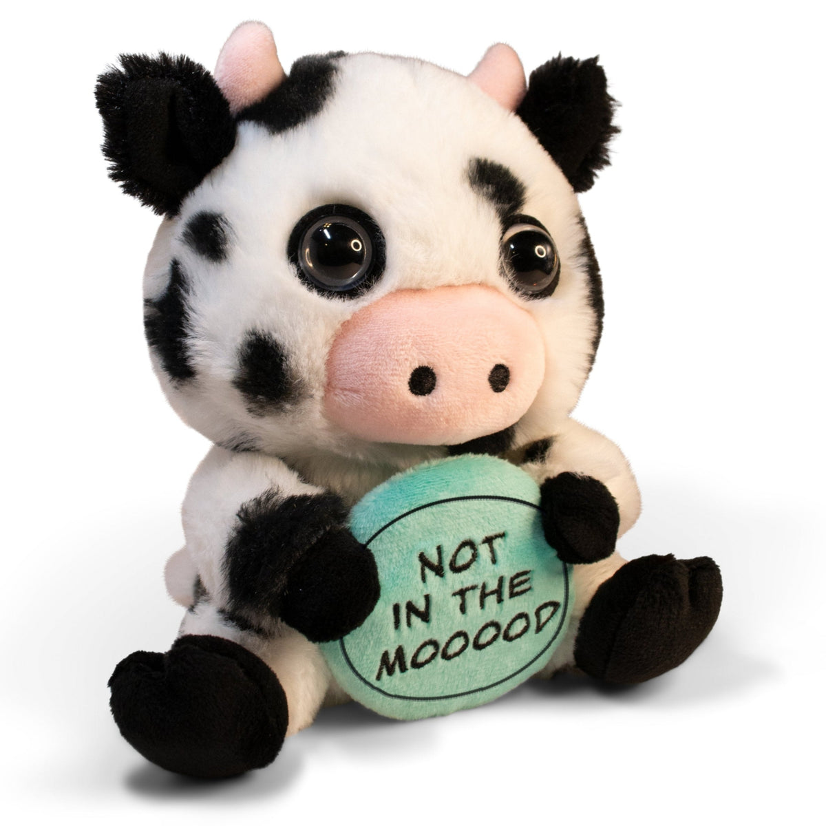 A plush cow holding a sign that reads 'not in the mooood.'