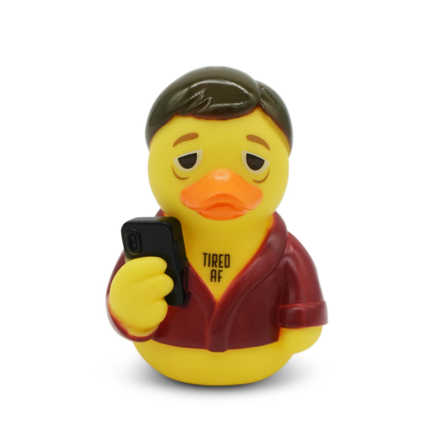 Rubber duck wearing a robe holding a phone with 'TIRED AF' text on a white background