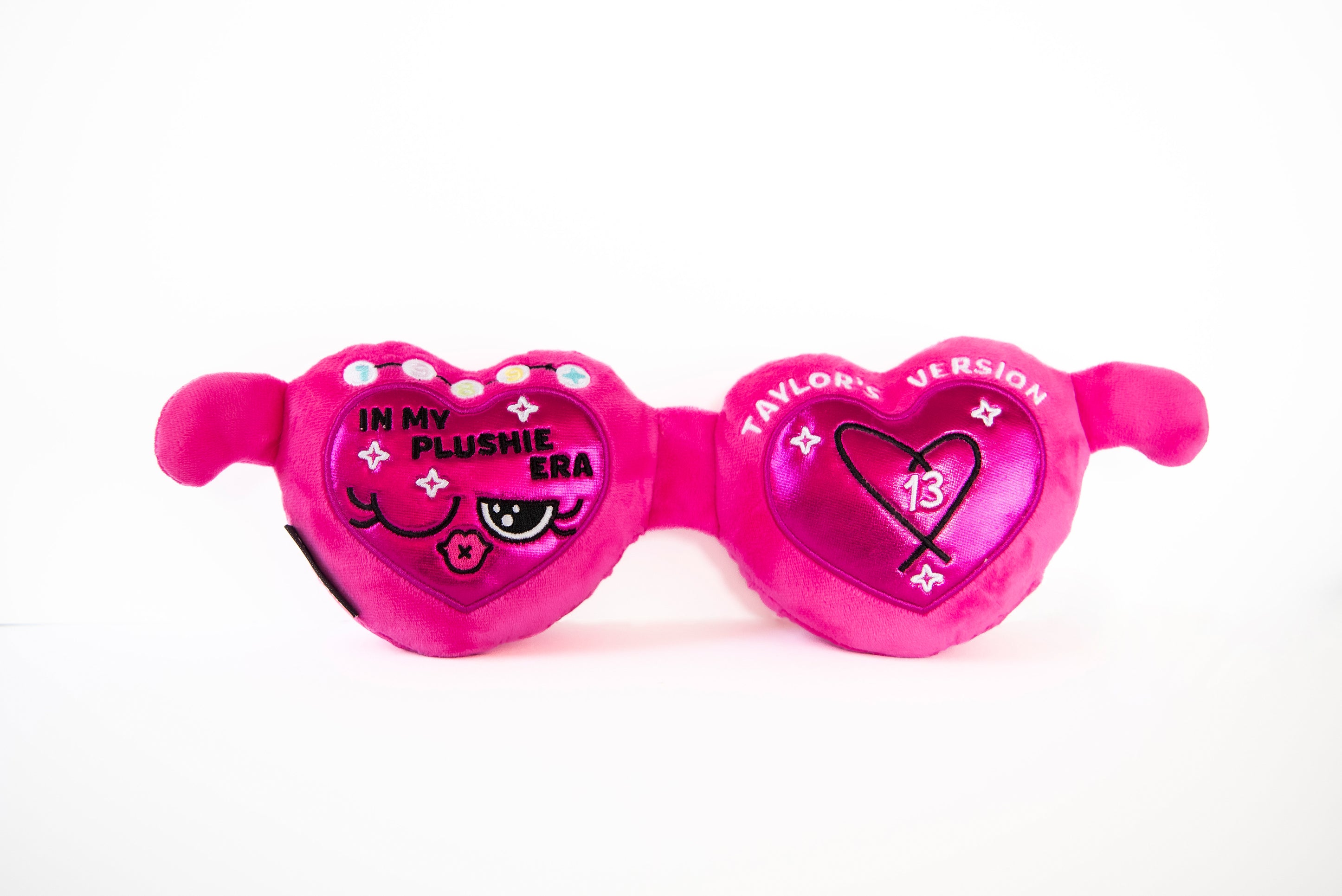 A plush resembling pink sunglasses with hearts and text that reads, "In my plushie era."