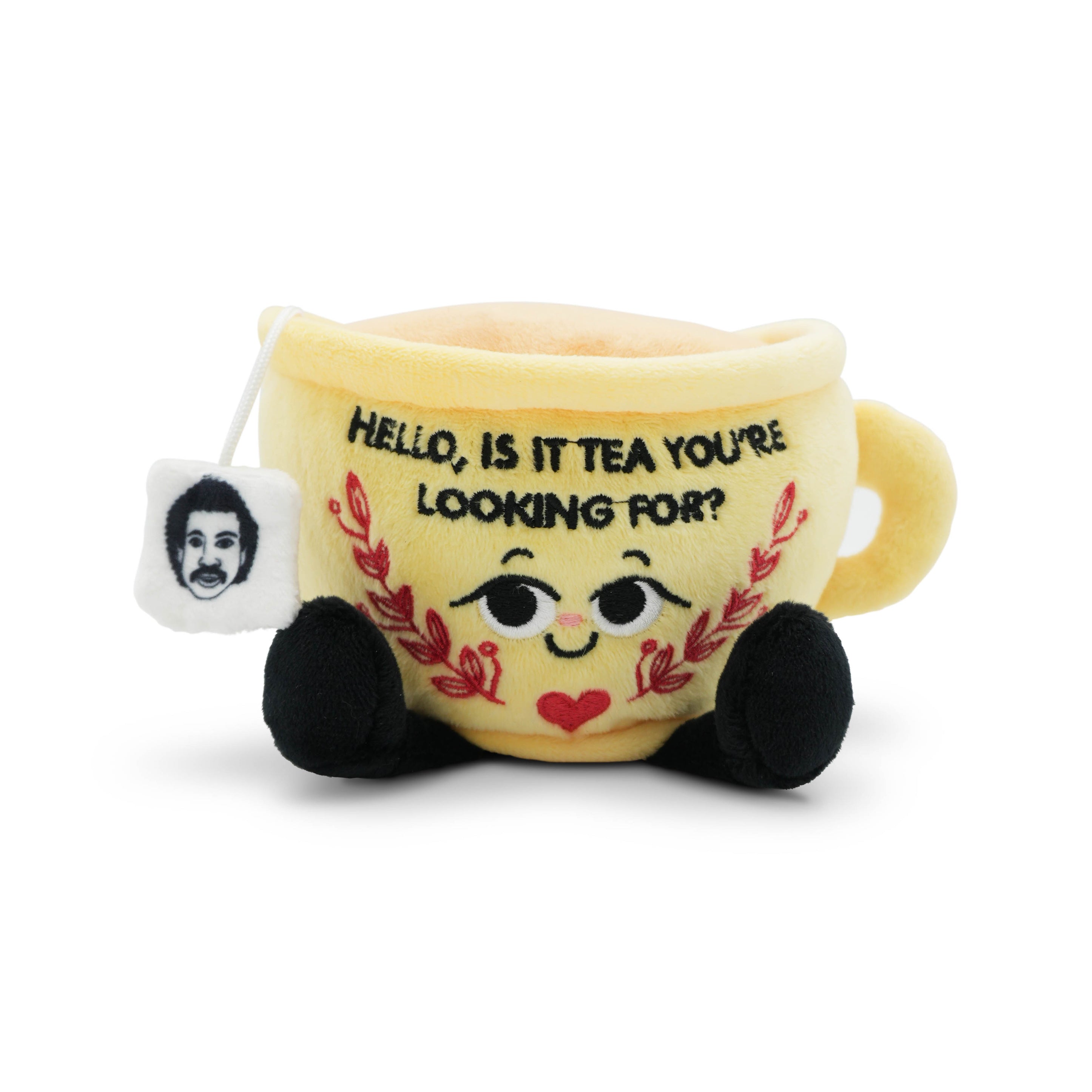 Plush toy resembling a teacup with a face and "Hello, is it tea you're looking for?" text on a white background.