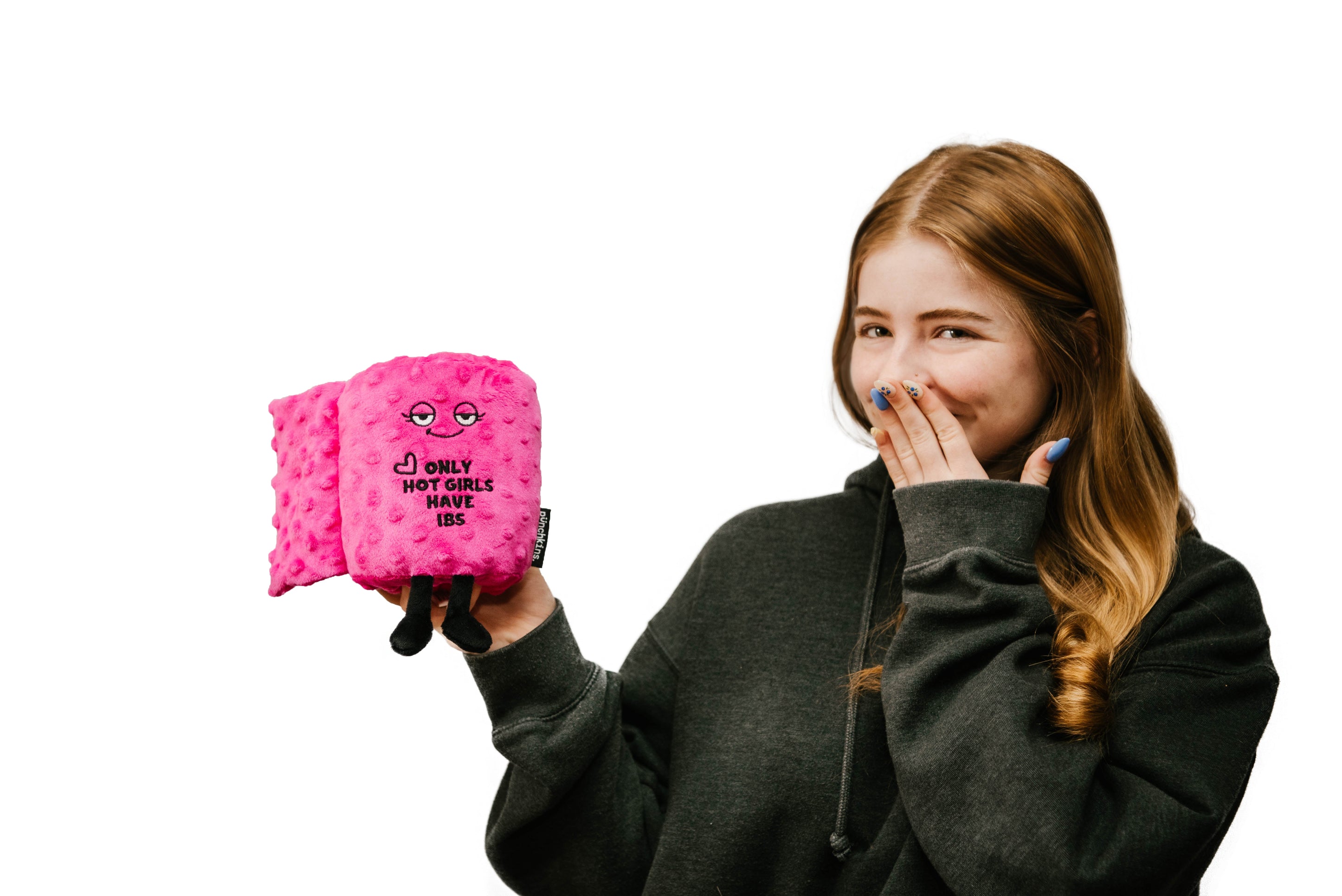 A brunette woman holding a plushie resembling a roll of toilet paper with a face and text that reads 'Only hot girls have IBS.'