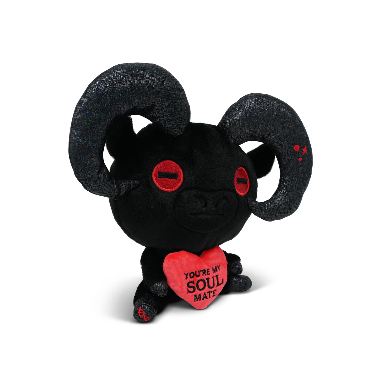 Black plush of a devil goat with red eyes and a heart saying 'You're my soul mate' on a white background