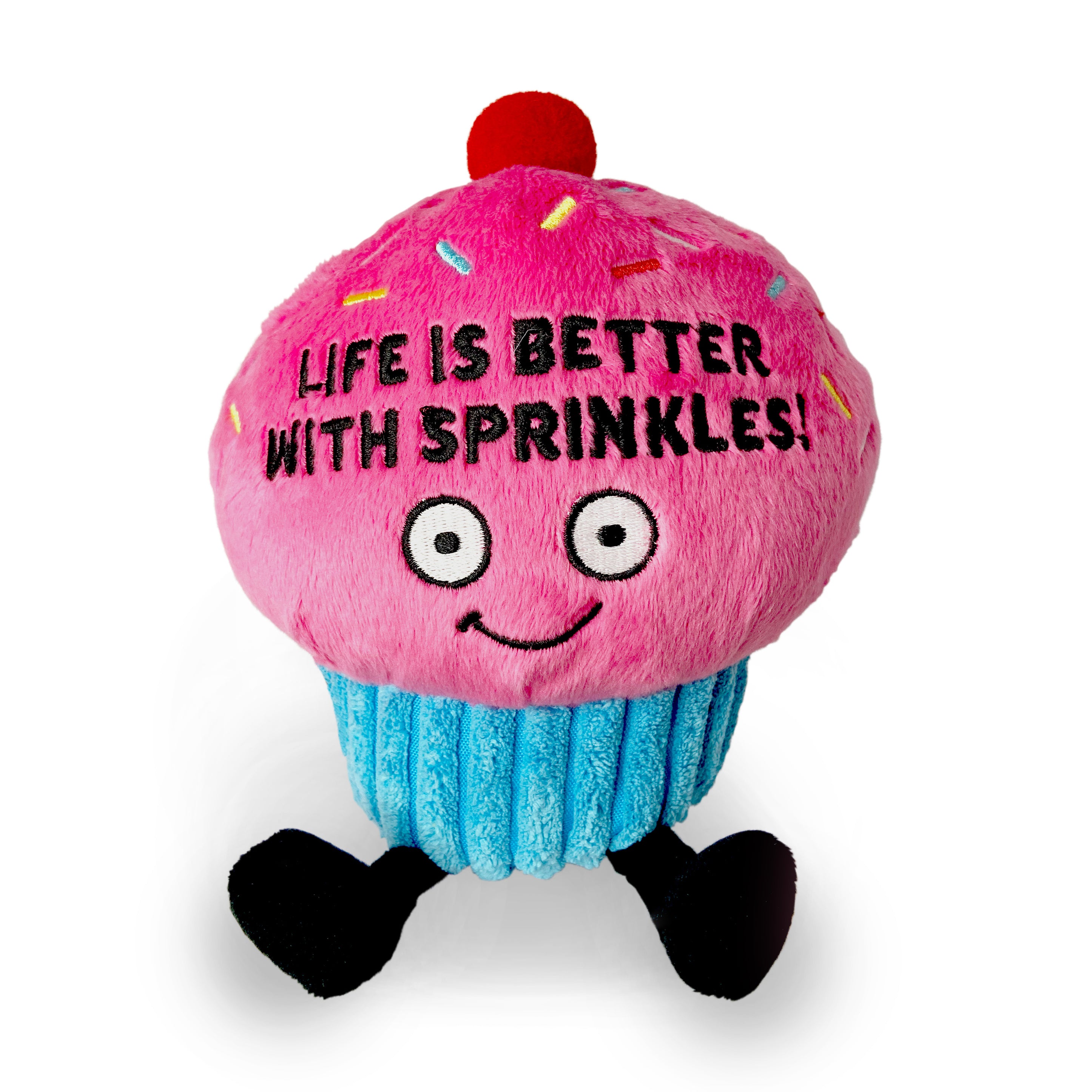 A plush shaped like a cupcake with pink frosting with the phrase 'LIFE IS BETTER WITH SPRINKLES!' written on it.